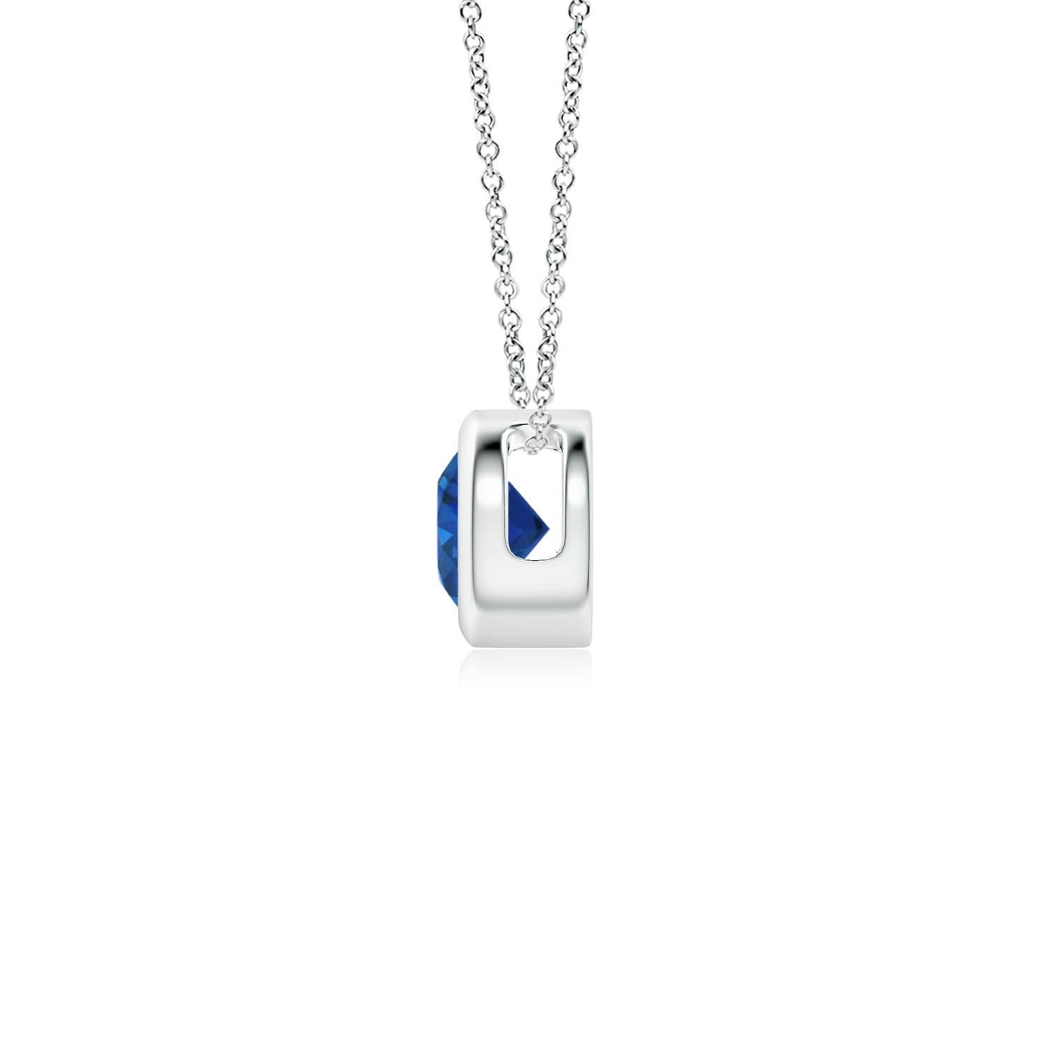 This classic solitaire sapphire pendant's beautiful design makes the center stone appear like it's floating on the chain. The radiant blue gem is secured in a bezel setting. Crafted in 14k white gold, this round sapphire pendant is simple yet