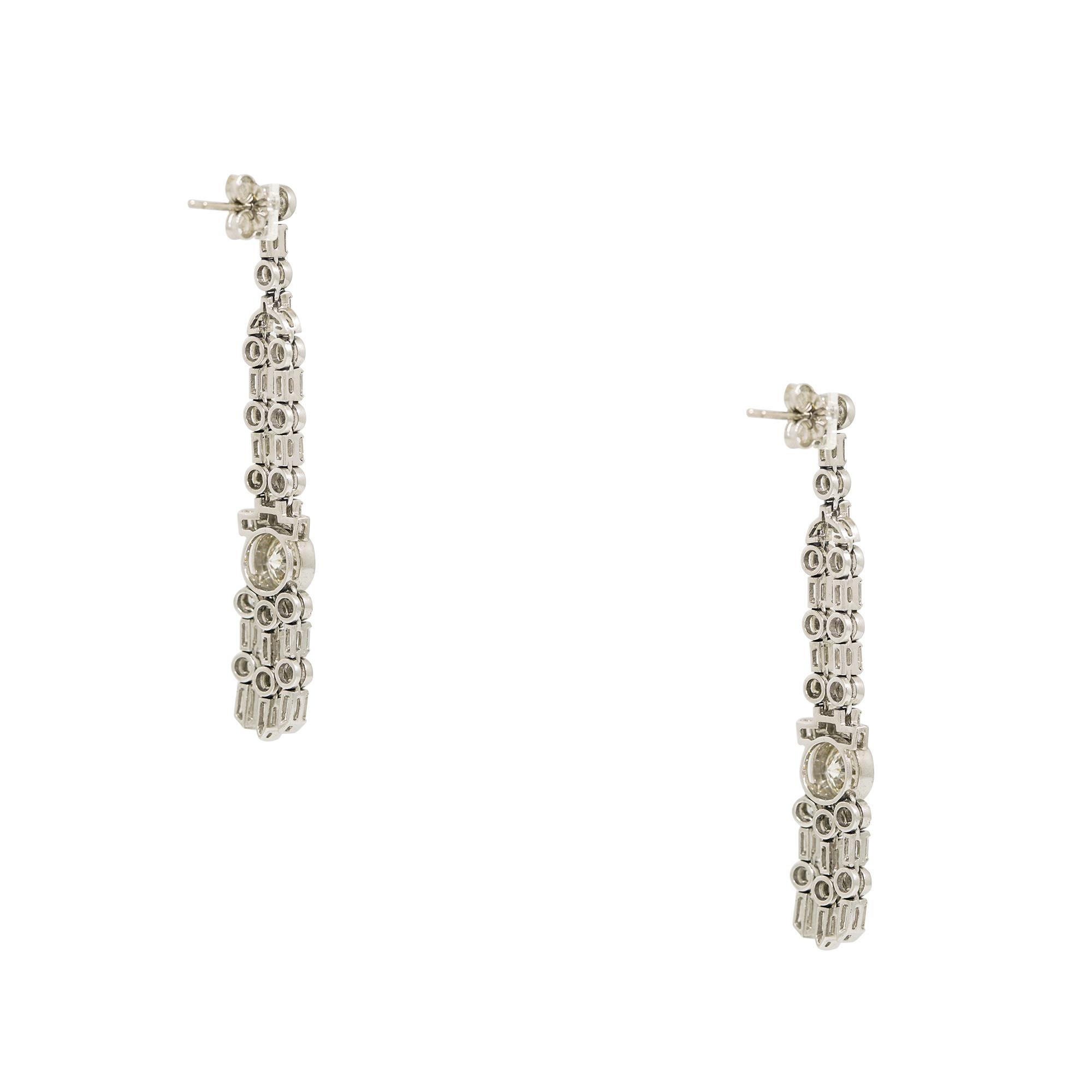 Platinum Natural 5.04 Carat Diamond Drop Vintage Earrings

This pair of diamond drop vintage earrings are elegant and timeless, featuring genuine natural, round brilliant-cut diamonds and baguette-cut diamonds, set in platinum. The earrings are