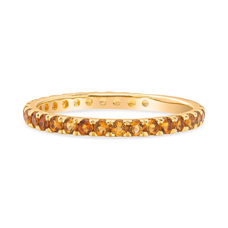 This band features 0.65 carat total weight in round natural citrines set in 14 karat yellow gold. Wear alone or stack with your other favorite bands. It is a size 7 but can be resized upon request.