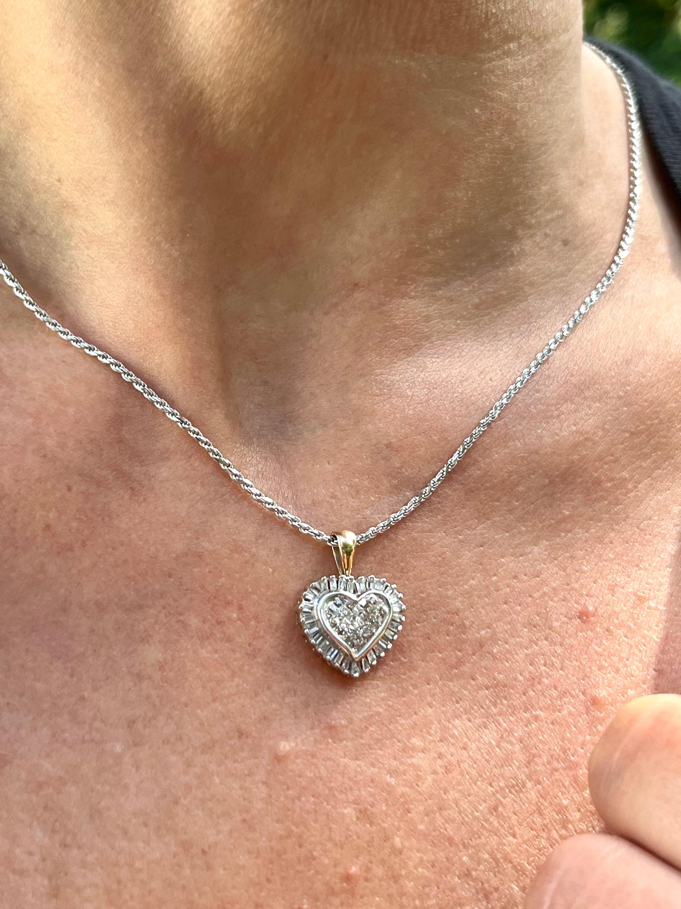 This stunning heart shape pendant features 0.70 carats in round and baguette-cut natural diamonds. The ideal fine jewelry gift at an affordable price. Solid gold, natural diamonds, and double rhodium-plated finish make this an ideal pendant for
