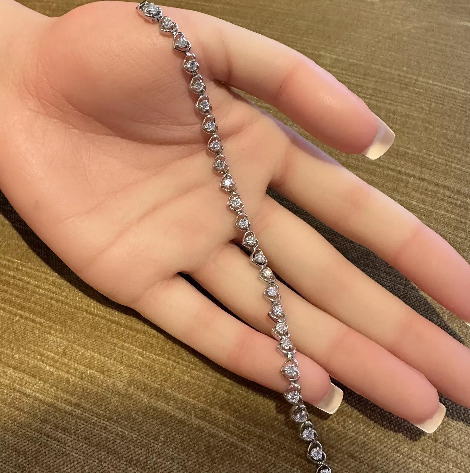 Natural Round Diamond Bracelet 2.82 cttw with Heart Shaped Platinum Setting

Natural Diamond Bracelet features Round Brilliant Diamonds set in Platinum Heart-shaped setting. The bracelet is secured by a box clasp with safety.

Total diamond weight