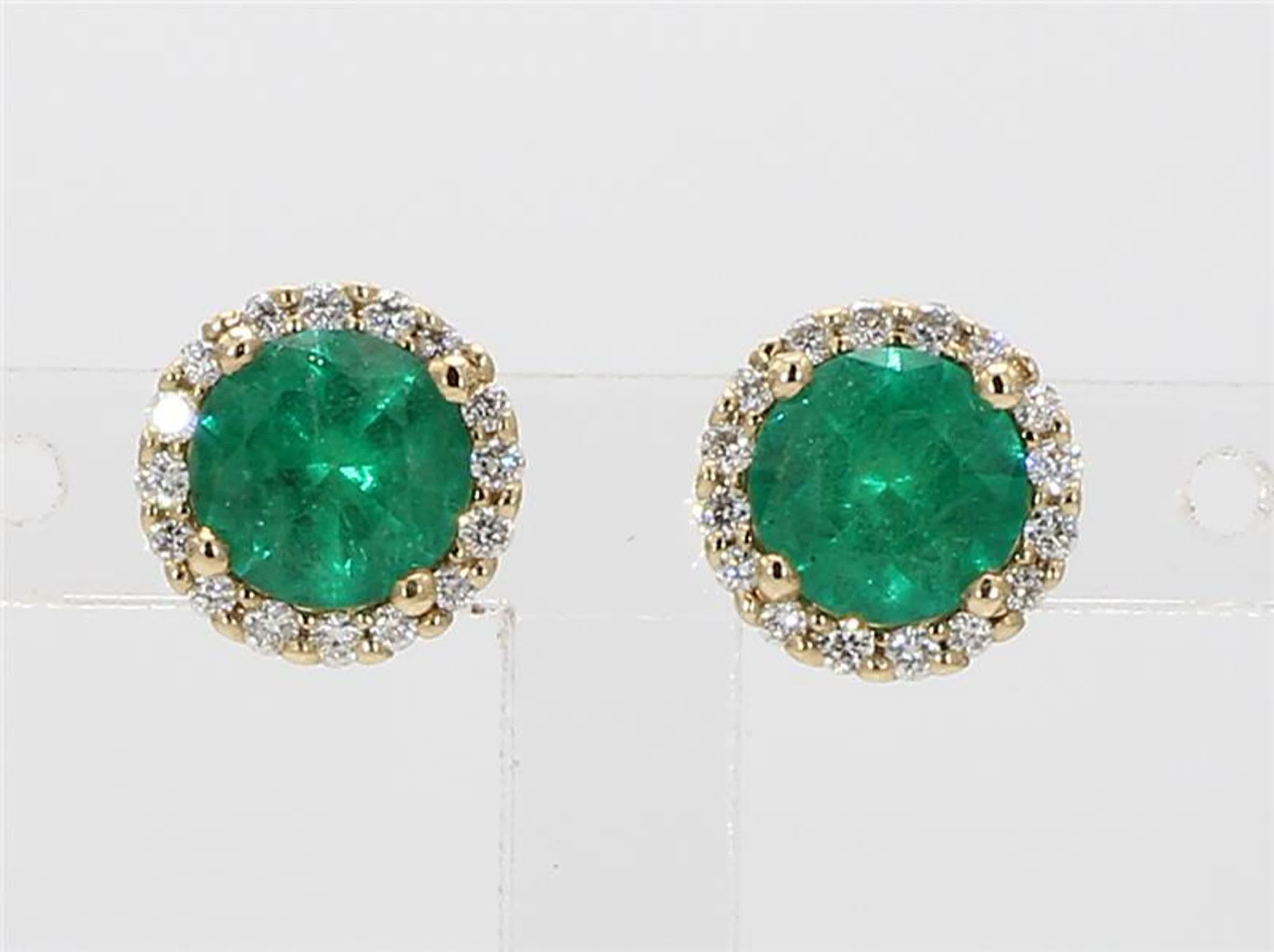 RareGemWorld's classic emerald earrings. Mounted in a beautiful 14K Yellow Gold setting with natural round cut green emerald's. The emerald's are surrounded by natural round white diamond melee. These earrings are guaranteed to impress and enhance