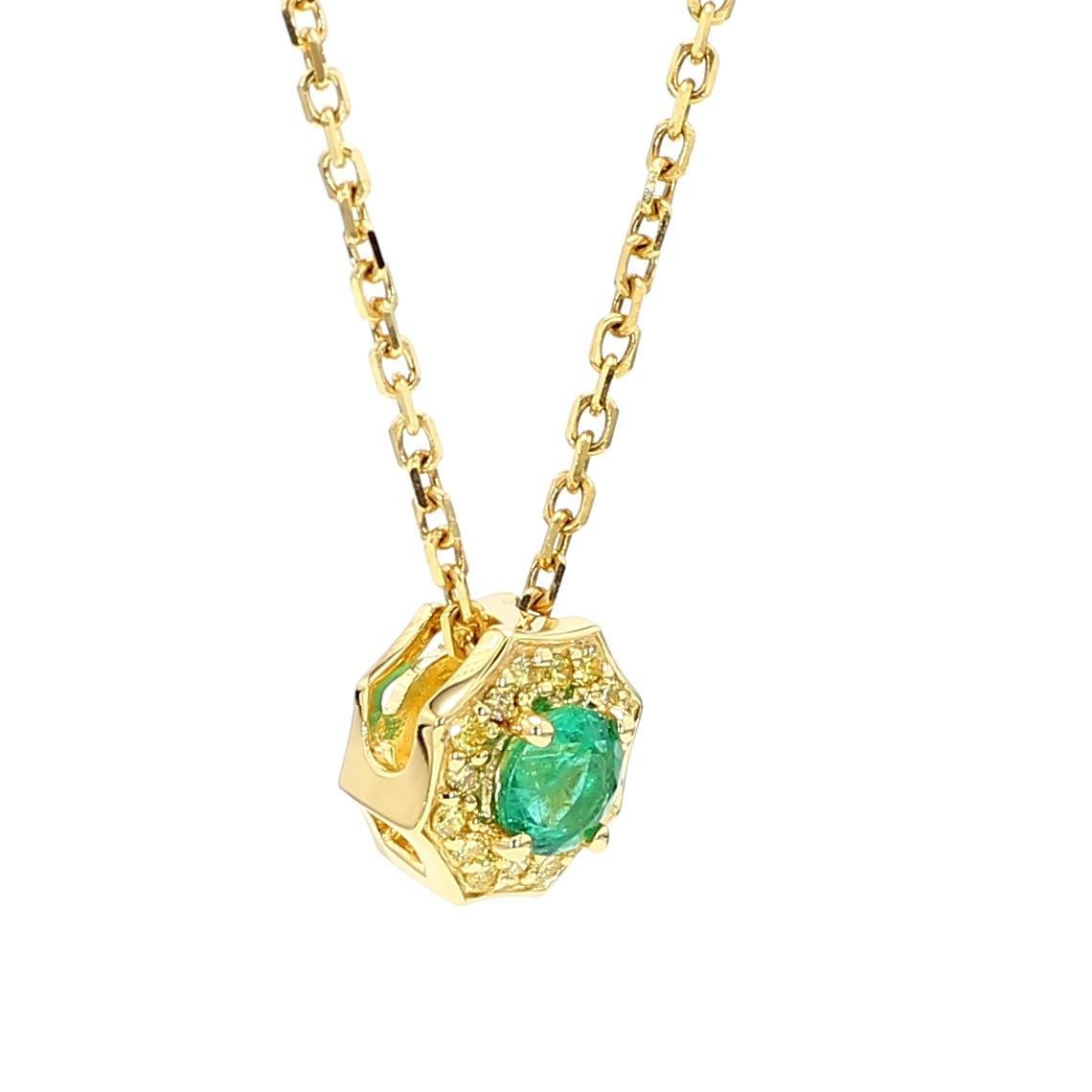 RareGemWorld's beautiful emerald pendant. Mounted in a beautiful 18K Yellow Gold setting with natural round cut emerald's. The emerald's are surrounded by natural round yellow diamond melee. This pendant is guaranteed to impress and enhance your