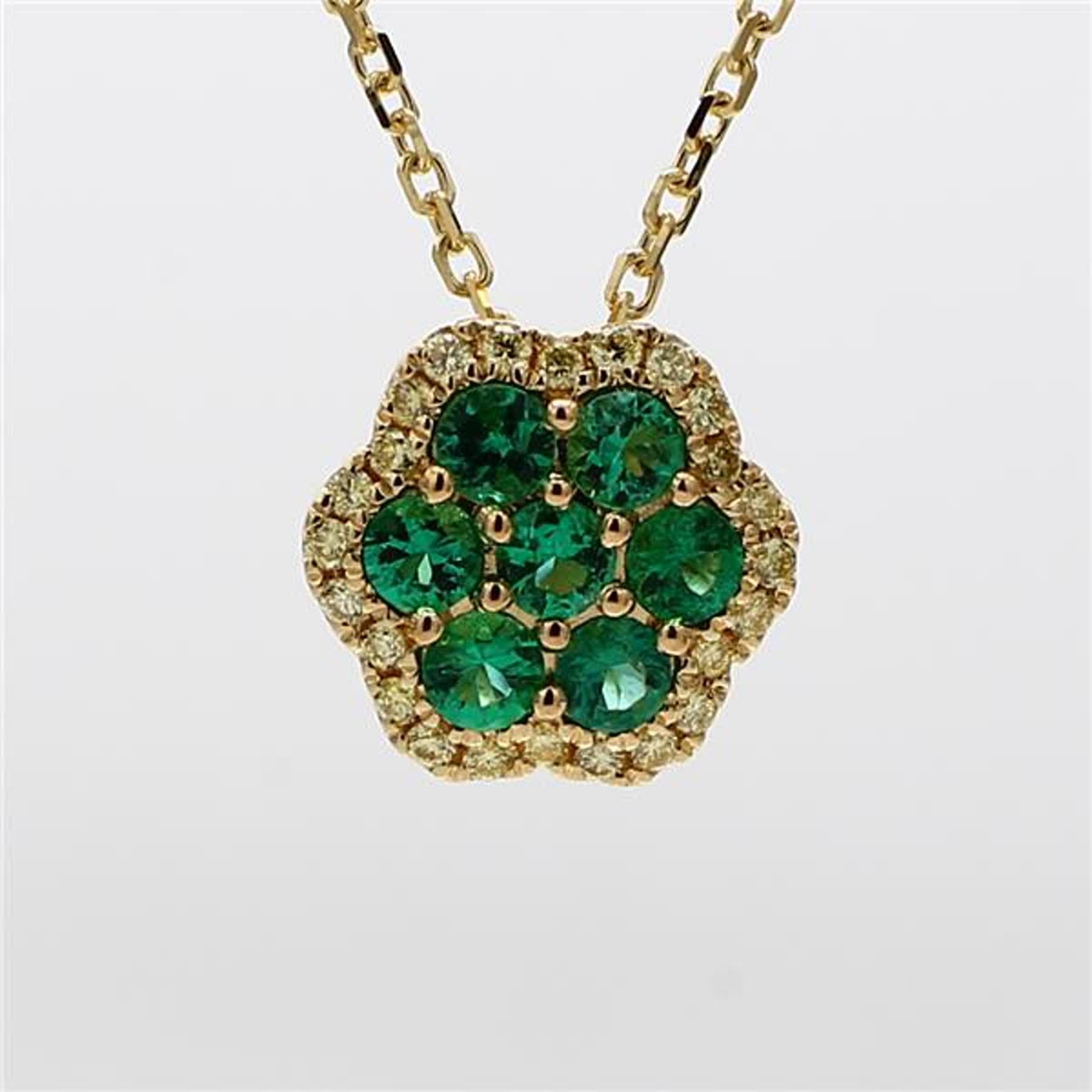 RareGemWorld's classic emerald pendant. Mounted in a beautiful 18K Yellow Gold setting with natural round cut emerald's. The emerald's are surrounded by natural round yellow diamond melee. This pendant is guaranteed to impress and enhance your