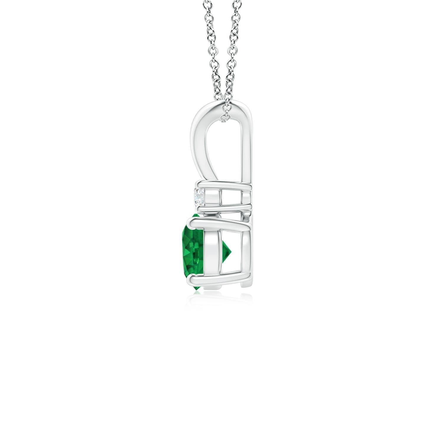 This four-prong set emerald pendant displays the perfect blend of style and beauty. A radiant diamond on top of the lush green gemstone enhances its charm. This classic solitaire emerald pendant with a polished v-bale is artfully designed in 14k