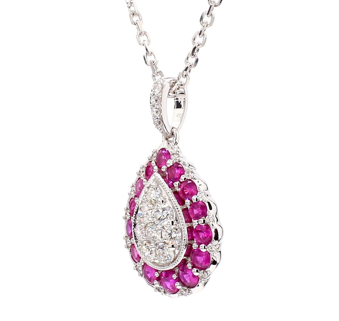 RareGemWorld's intriguing ruby pendant. Mounted in a beautiful 14K White Gold setting with natural round cut red rubys. The rubys are surrounded by natural round cut white diamond melee. This pendant is guaranteed to impress and enhance your