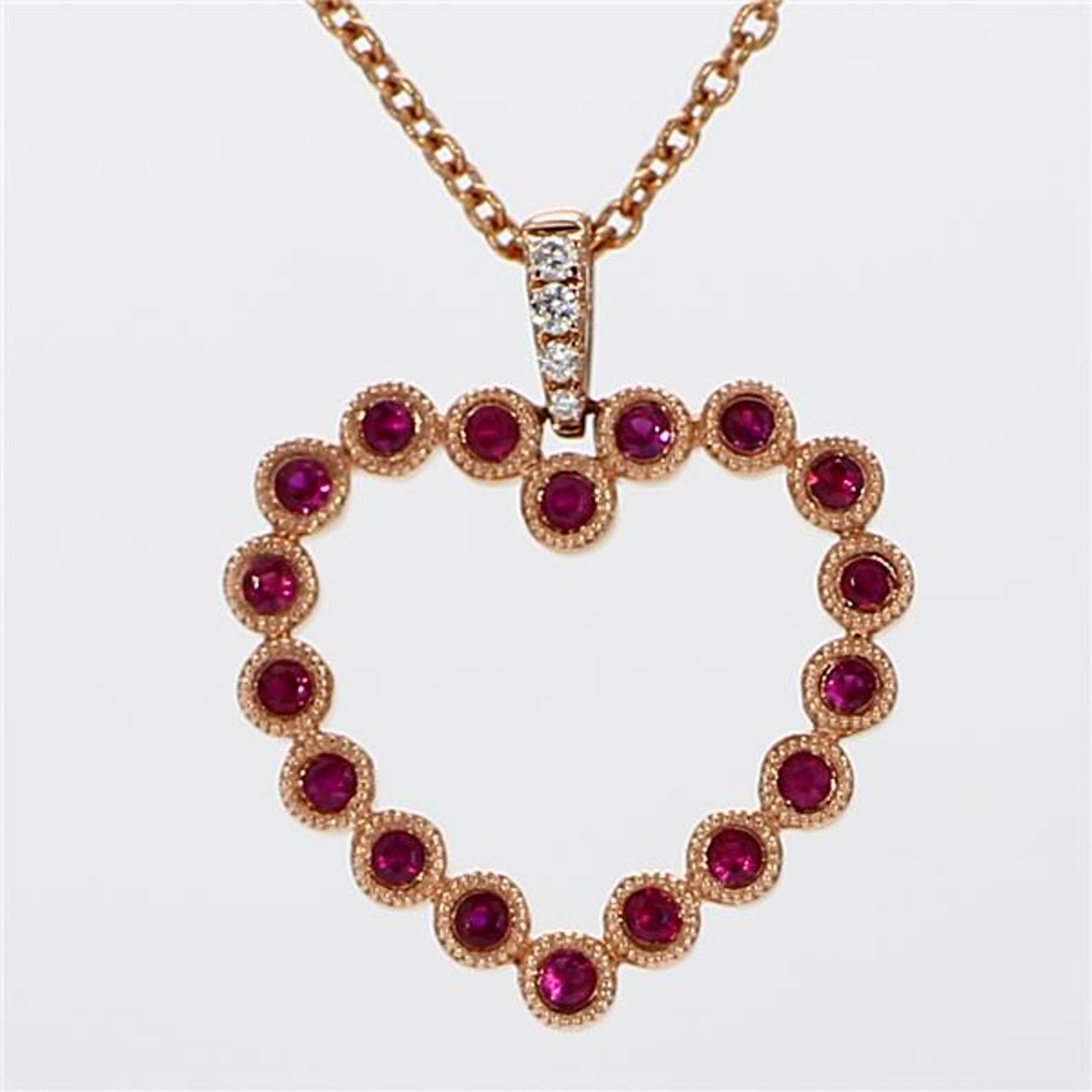 RareGemWorld's classic ruby pendant. Mounted in a beautiful 18K Rose Gold setting with a natural round cut red ruby's complimented by natural round cut white diamond melee in a beautiful heart shape. This pendant is guaranteed to impress and enhance