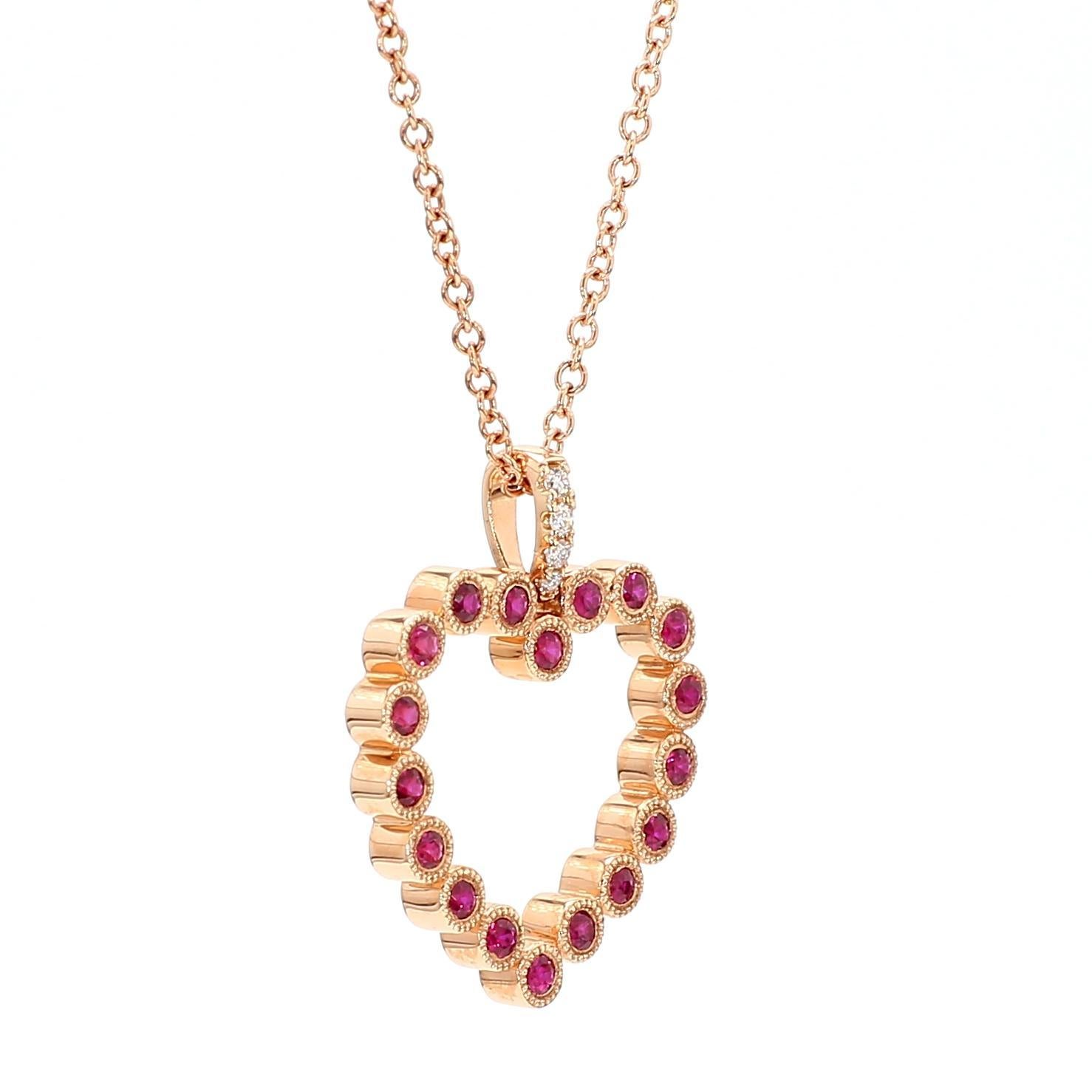 RareGemWorld's beautiful ruby pendant. Mounted in a beautiful 18K Rose Gold setting with natural round cut red ruby complimented by natural round cut white diamond melee. This pendant is guaranteed to impress and enhance your personal