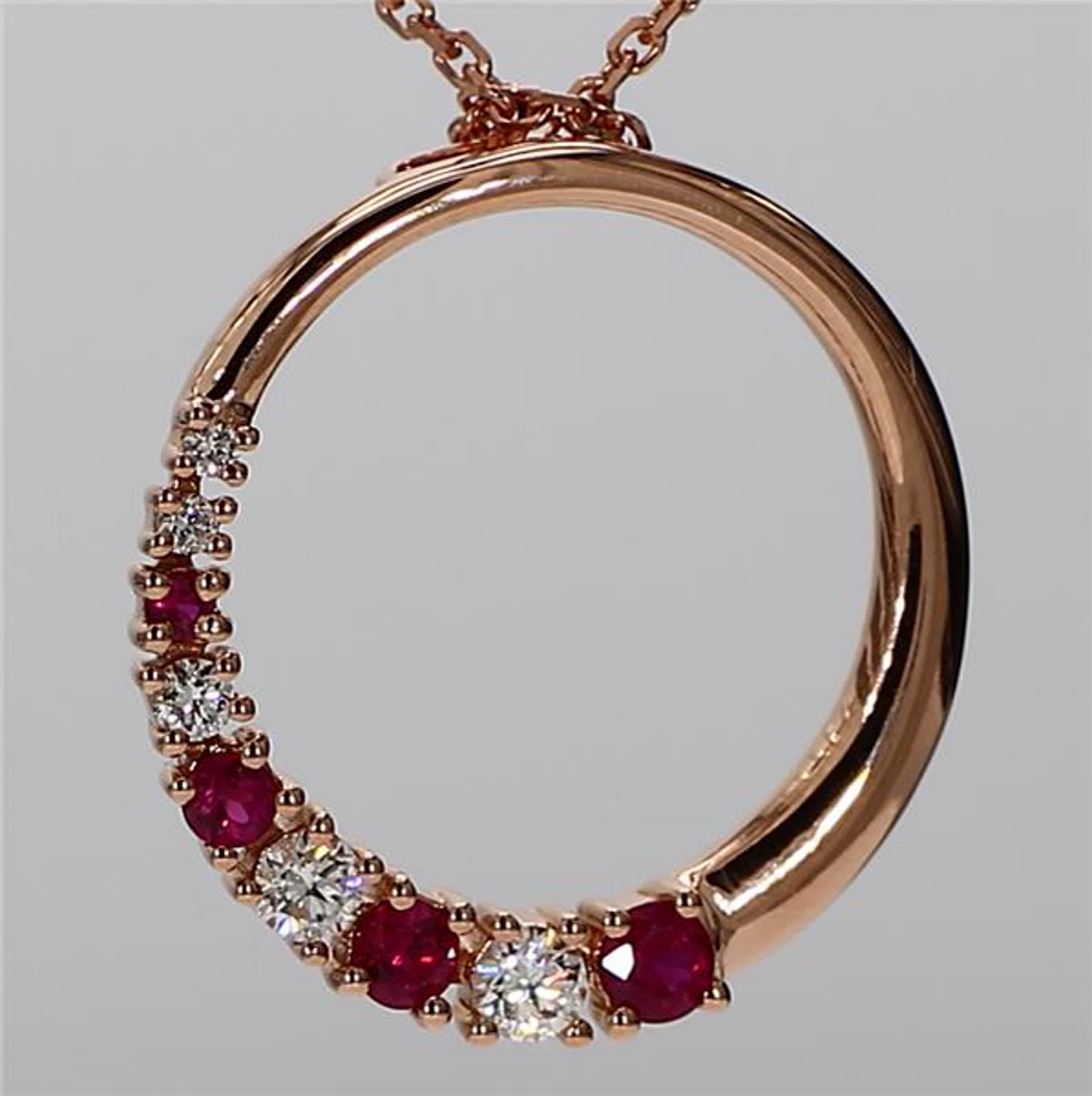 RareGemWorld's classic ruby pendant. Mounted in a beautiful 18K Rose Gold setting with a natural round cut red ruby's complimented by natural round cut white diamond melee. This pendant is guaranteed to impress and enhance your personal