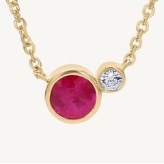Natural Round Red Ruby and White Diamond .43 Carat TW Yellow Gold Pendant
