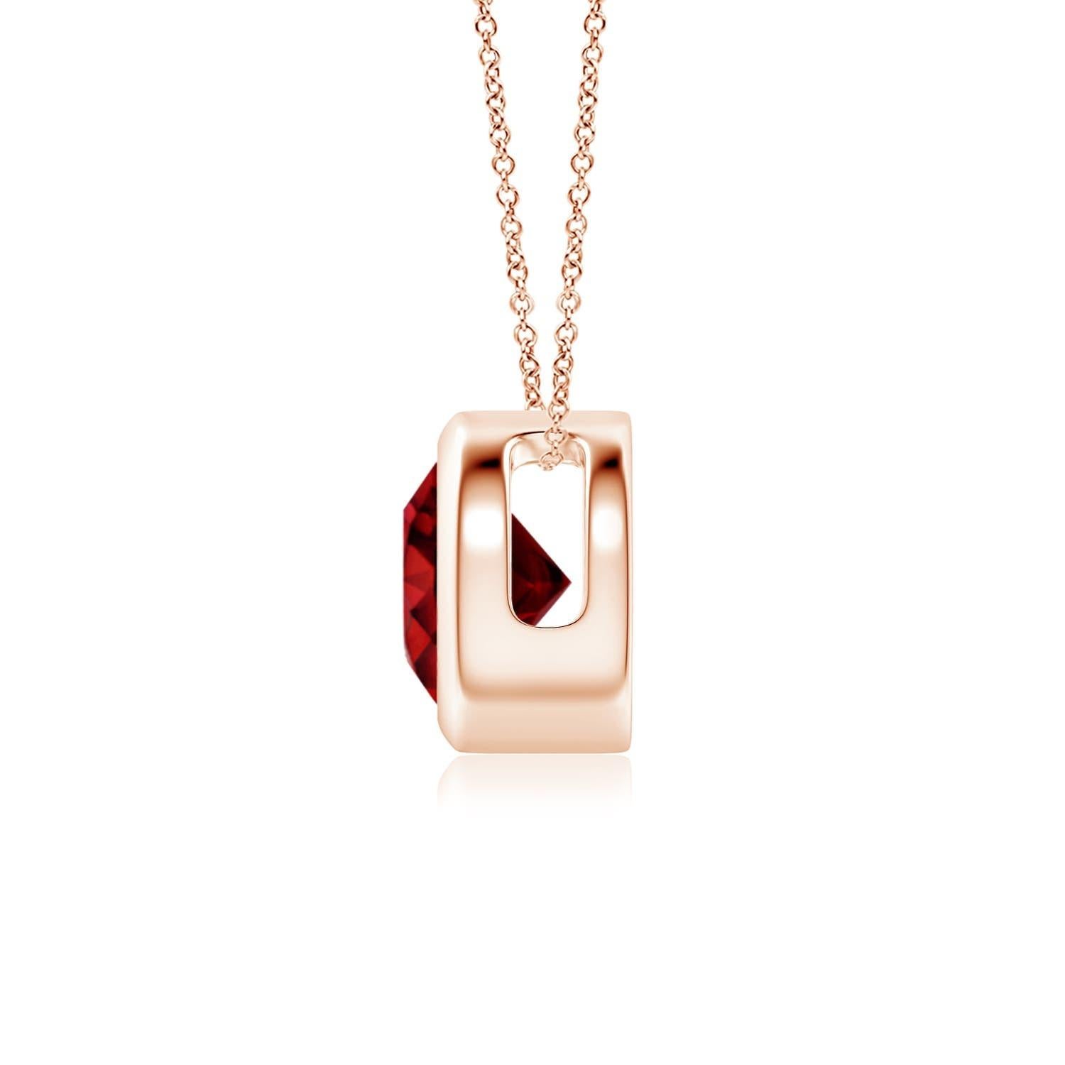 This classic solitaire ruby pendant's beautiful design makes the centre stone appear like it's floating on the chain. The purplish red gem is secured in a bezel setting. Crafted in Platinum, this dazzling round ruby pendant is simple yet