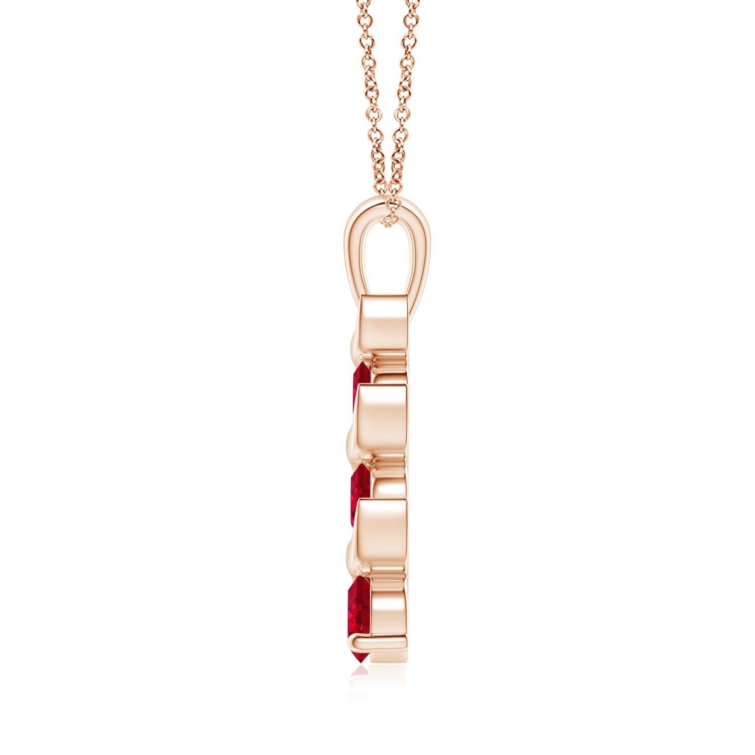 Channel set in an exquisite journey trail, the three graduating round rubies exude their bold and striking red hue. This gorgeous three stone ruby pendant is designed in 14K rose gold and connects to a lustrous metal bale.
Ruby is the birthstone for
