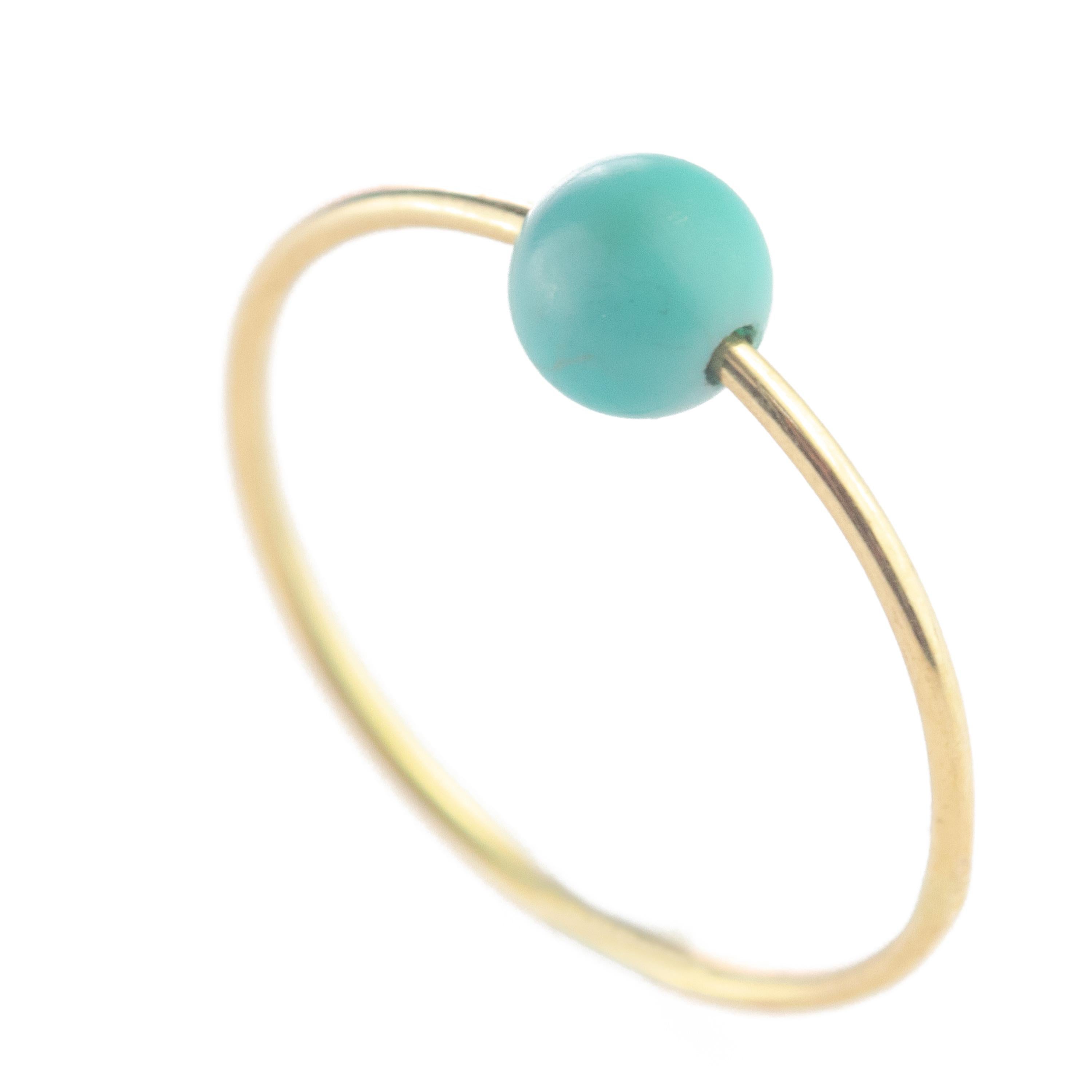 Signature INTINI Jewels Neptune Planet band ring. Contemporary ring design in 9 karat yellow gold with a precious round turquoise.  Design and color mixed in one jewel. Delight yourself with a strong, minimalist design, just for a stunning chic