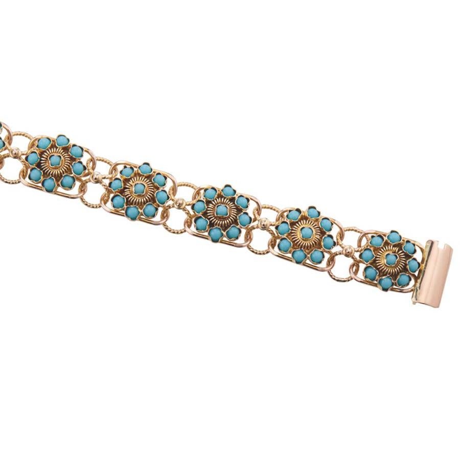 Unique 1930's Art Deco vintage Turquoise bead flower link design bracelet with original slide style catch. Adorned with 108 round turquoise that measures 2.3mm each. Set in flower formations which are connected by twisted wired designed loops. Hand