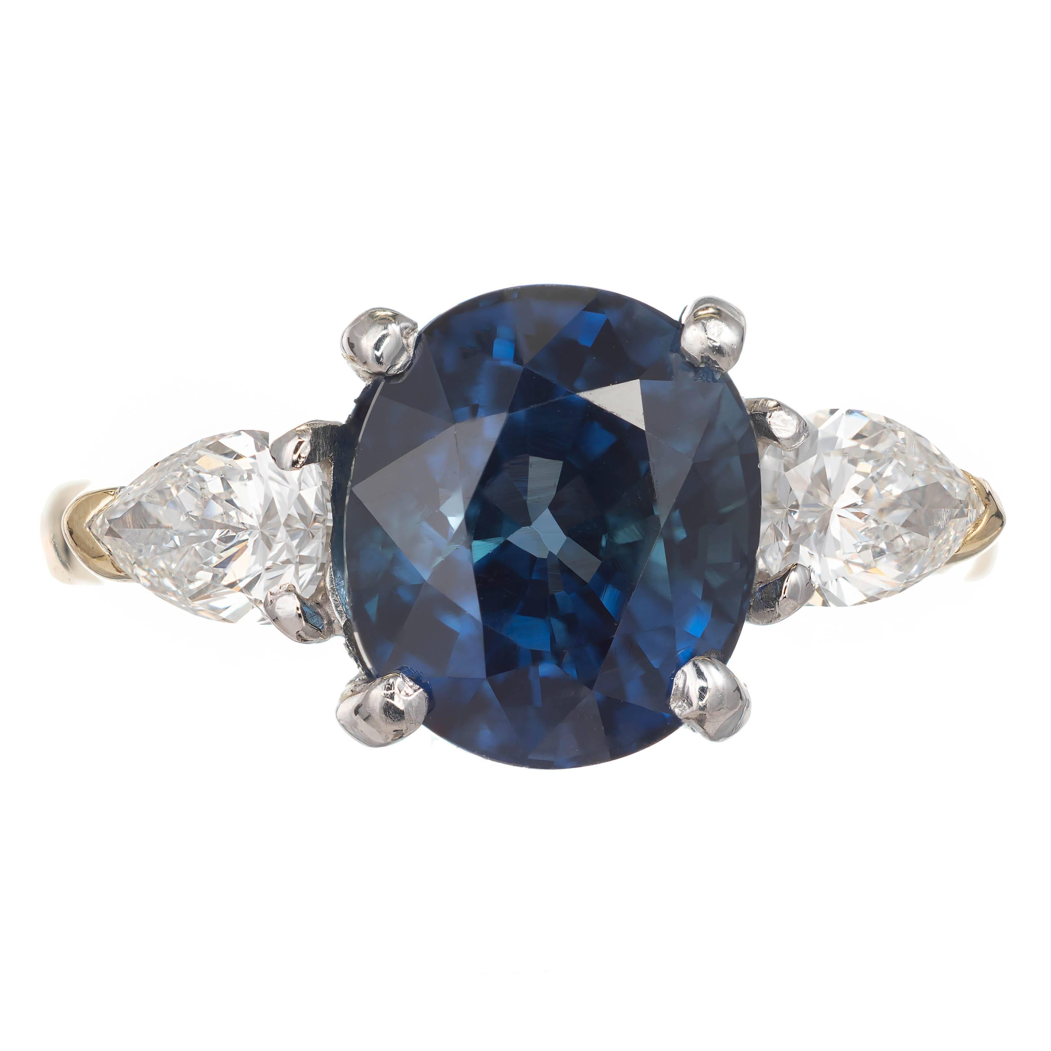 Natural no heat Royal blue fine oval Sapphire and pear shaped diamond engagement ring. In its original handmade 18k yellow gold and platinum setting with bright sparkly pear shaped side diamonds.

1 oval no heat and no enhancements 4.35ct blue