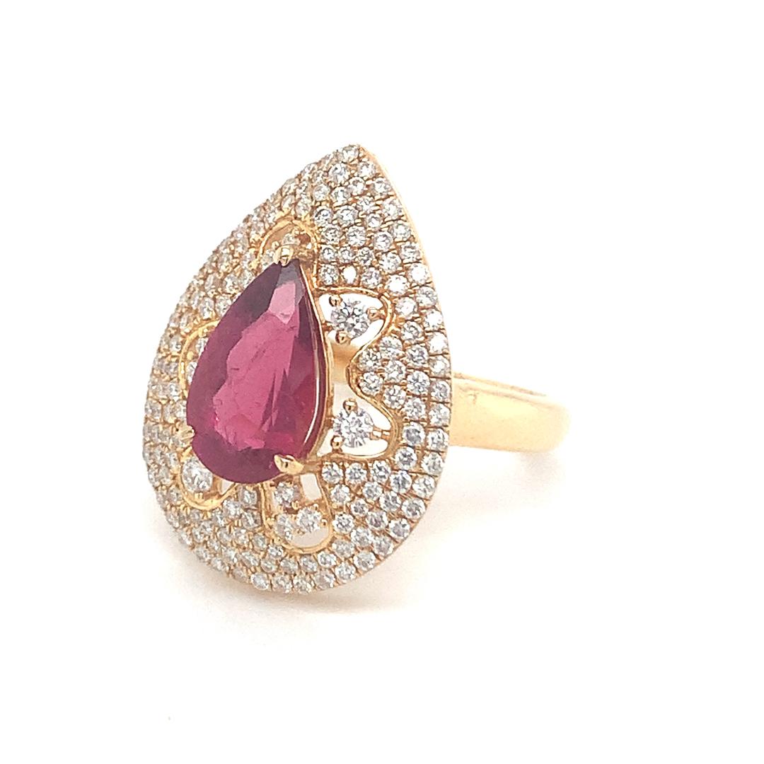 Natural 2.09 Carat Rubelite and 0.92 Carat diamond ring is set in 18 Kt yellow gold. 