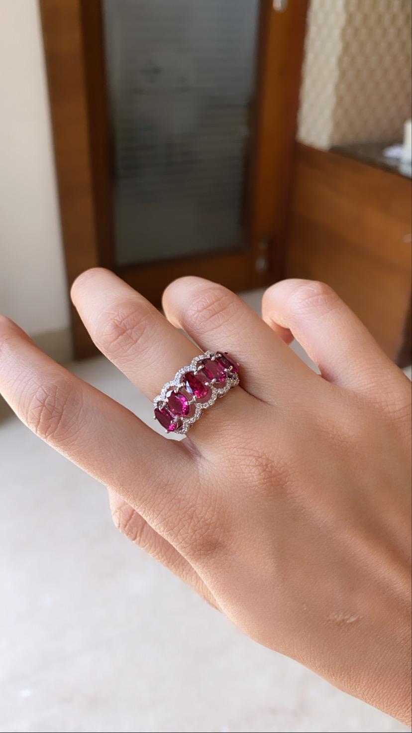 A simple and elegant rubellite band ring set in 18k white gold with natural diamonds. The rubellite weight is 3.85 carats and diamond weight is .45 carats. The net gold weight is 4.736 grams and ring dimensions in cm 1.5 x 2.5 x 2.2 (LXWXH). US size