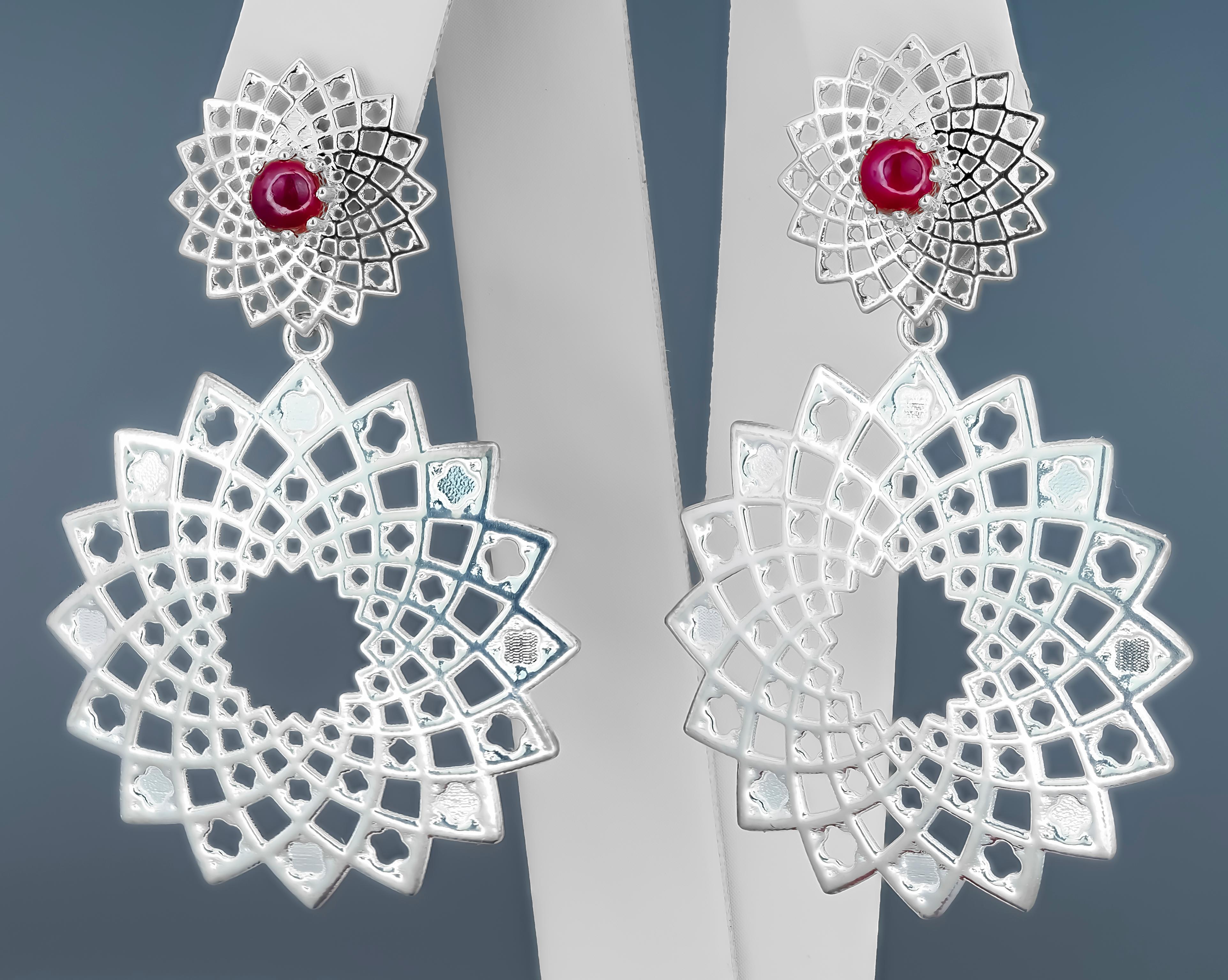 Natural rubies earrings. 

Massive earrings with rubies. 
Different type wearring massive earrings with rubies - lower part removable. 
You can wear earring in different ways: as studs (for everyday wearring) and as a massive earrings. 
You can see