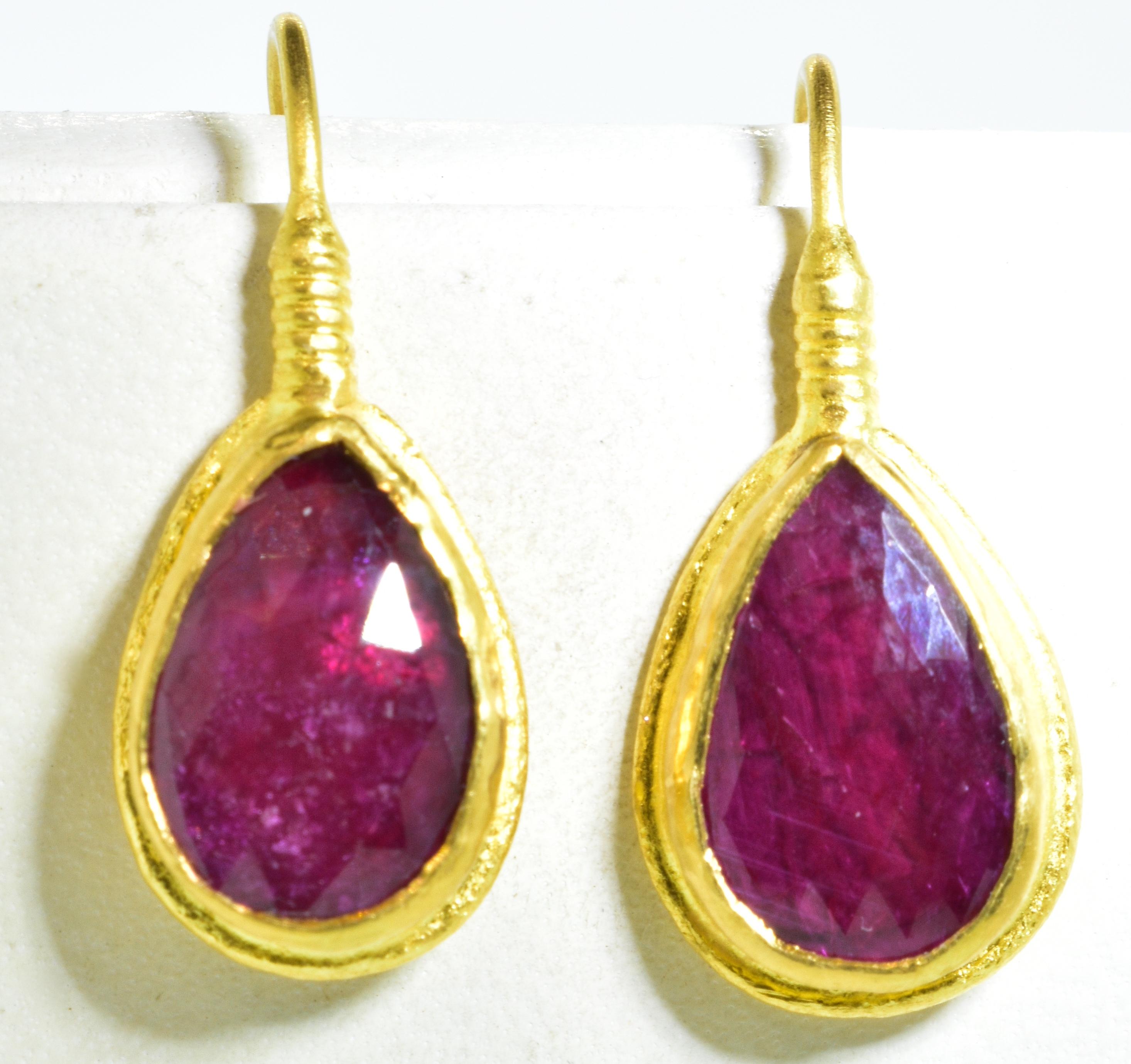 Ruby and high karat gold earrings with natural rubies weighing approximately 3.0cts, set in 23K gold.  These earrings weigh 3 dwt., are 1 inch in length and signed on the back by ARA and 985 which is for the gold karat.  Contemporary and new, these