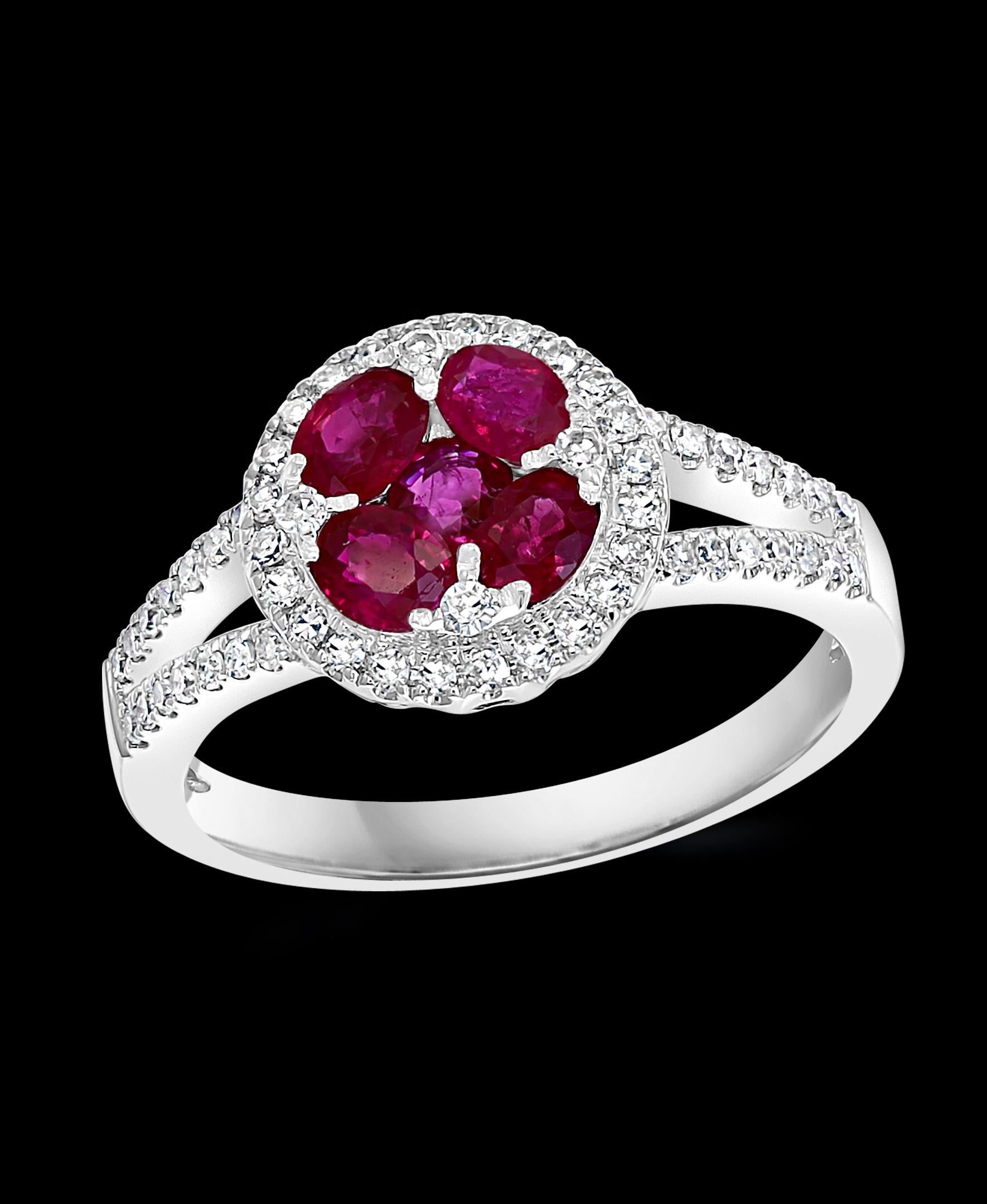 Natural  Ruby and  Diamond 14 Karat White Gold Ring Size 7
 5 pieces , approximately 0.5   Carat of very clean   natural  Ruby  makes a center flower
surrounded by clean brilliant cut diamonds
Ring Size 7 ( can be altered )
Diamonds:  approximate