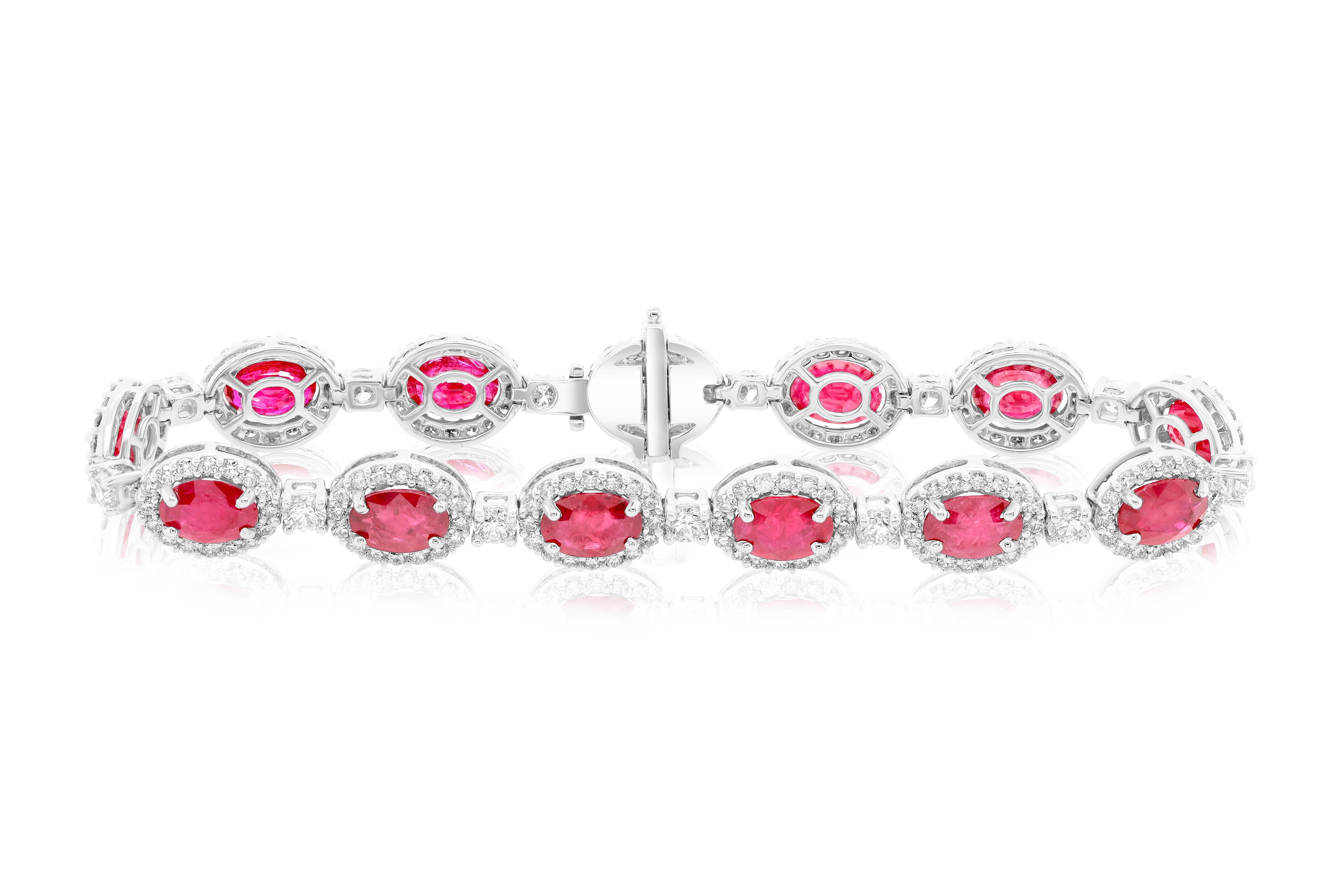 18k white gold ruby and diamonds five row bracelet. 
Gem information:
11.91 Carats of 13 Oval Shaped Natural Certified Rubies

Diamond information:
4.12 carats of round brilliant cut diamonds. 

G H in color SI in clarity 
