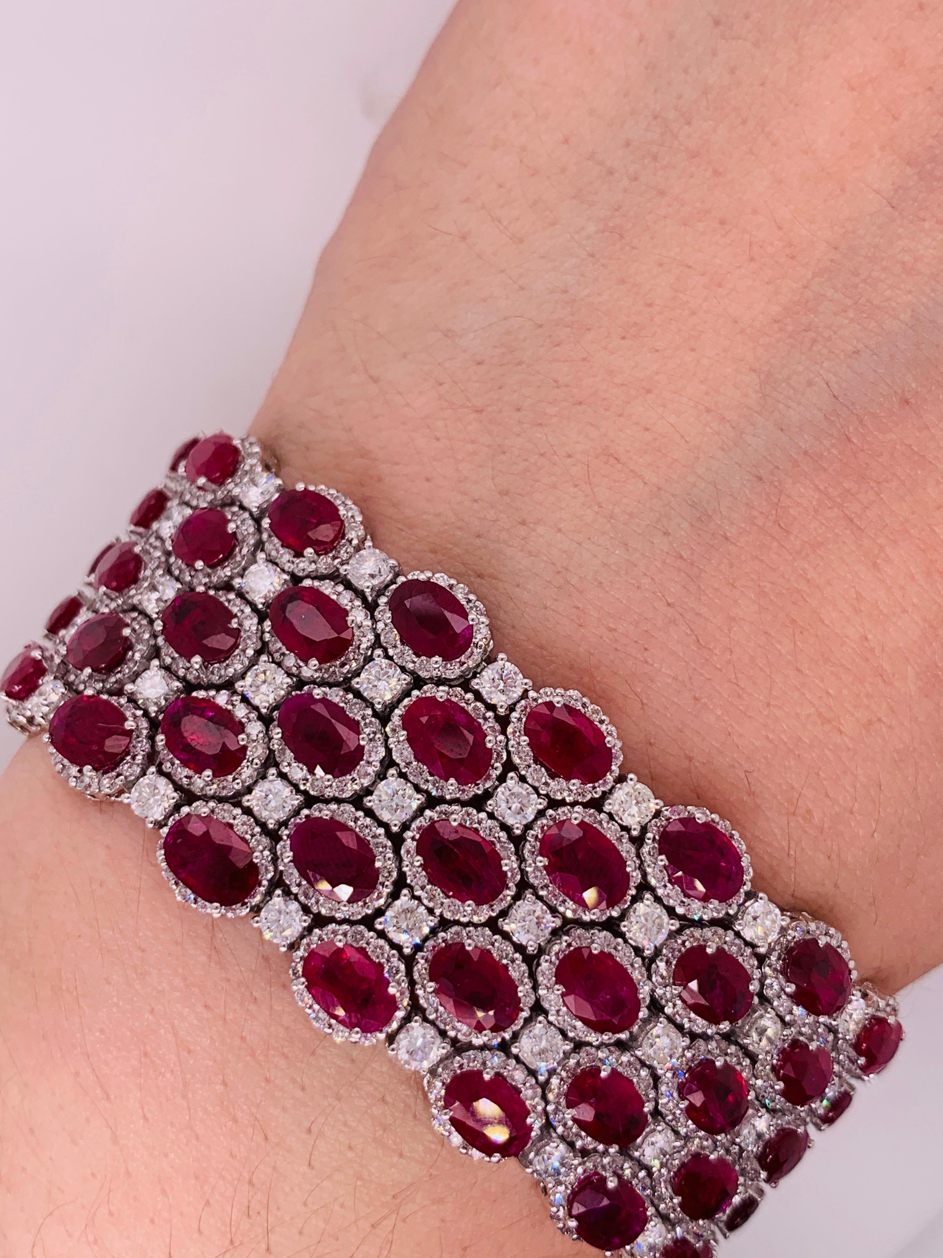 18k white gold ruby and diamonds five row bracelet. 
Gem information:
44 carats of natural rubies. 

Diamond information:
15 carats of round brilliant cut diamonds. 

G H in color SI in clarity 
