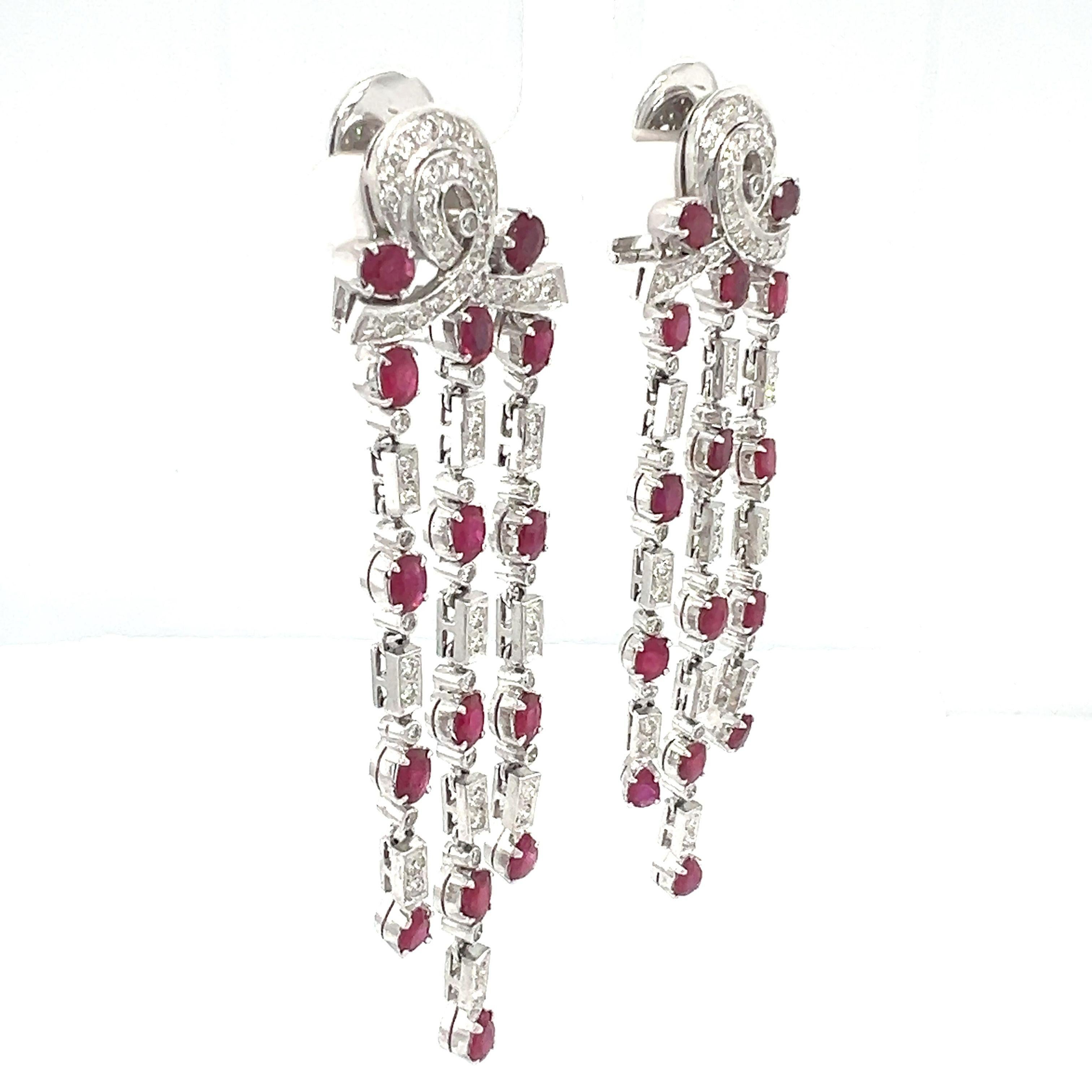 A beautiful pair of natural Ruby and diamonds clip-on dangle solid earrings, feature with 6.50-carat Ruby and 3.50-carat diamonds set in 10-kt white gold. 