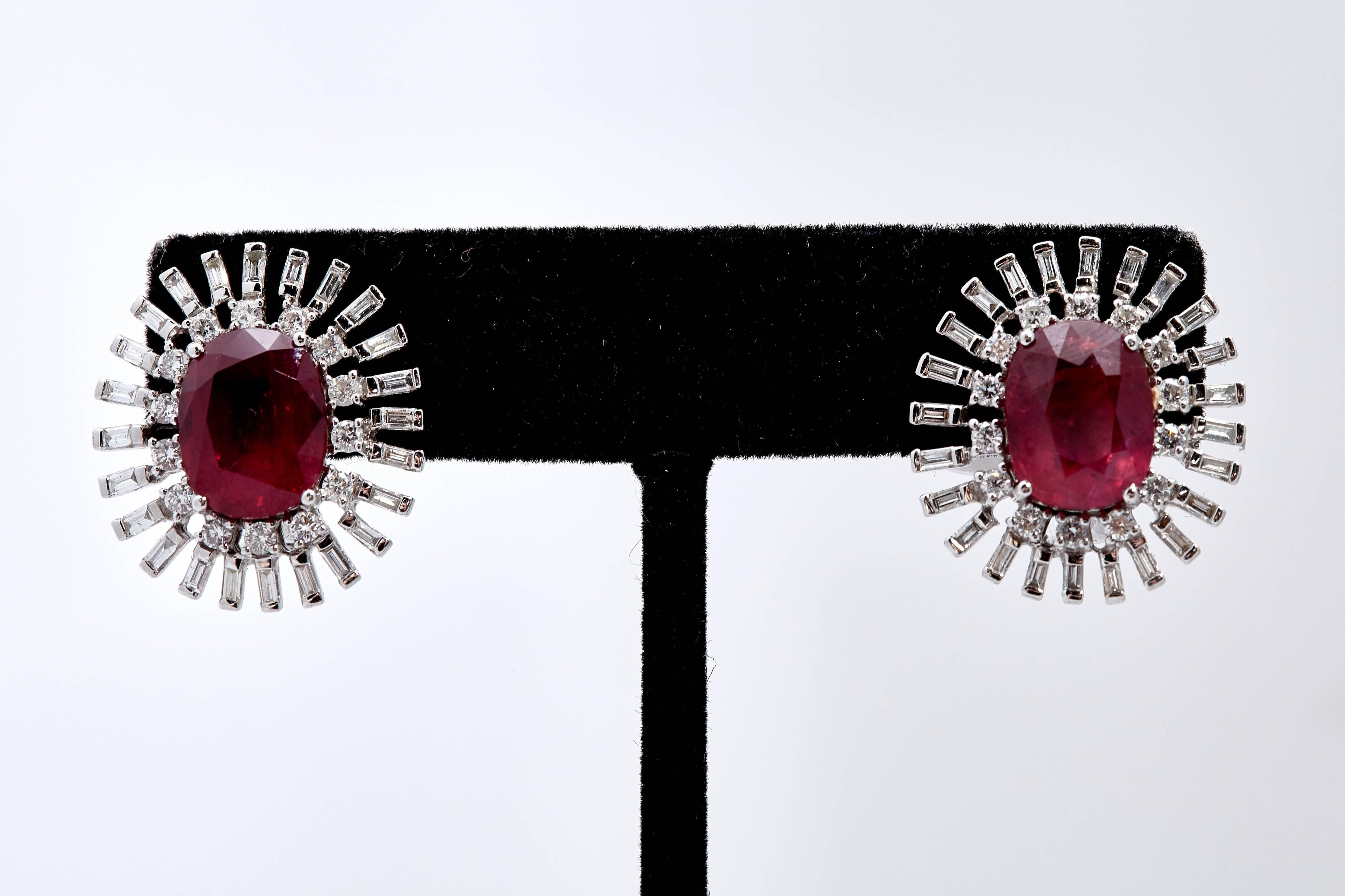 A pair od classic ear-clips in 18kt white gold with diamonds and, oval step-cut natural Tanzania rubies (5.68 and 5.23 cts - no indication of thermal treatment). GRS (Gem Research Swiss Lab) certificates. Circa 1980s