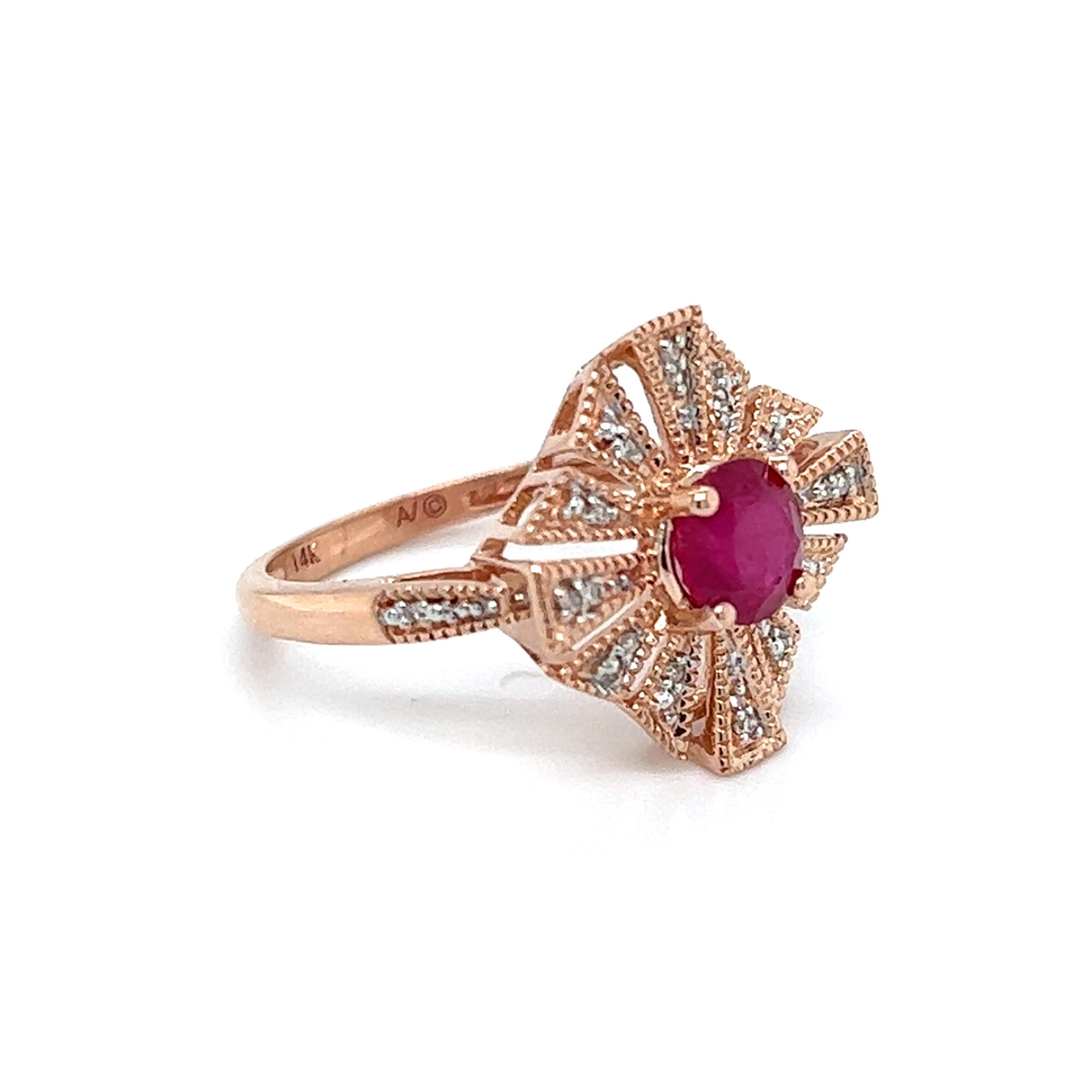 One 14-karat rose gold ring set with one 6mm natural round ruby and twenty-eight round brilliant cut diamonds, approximately 0.20-carat total weight with matching H/I color and I1 clarity.  The ring is a finger size 6.75 and is resizable.  Sizing is