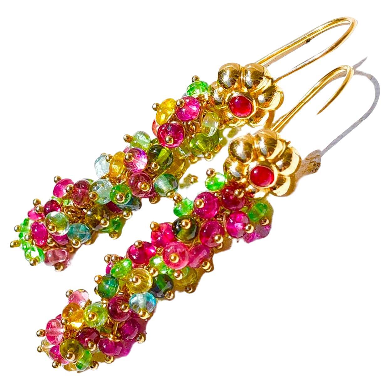 Multi-colored and shiny tourmaline beads have been capped with 18K Yellow Gold Natural Ruby ear wires. These earrings are the right touch of elegance for a special lady!