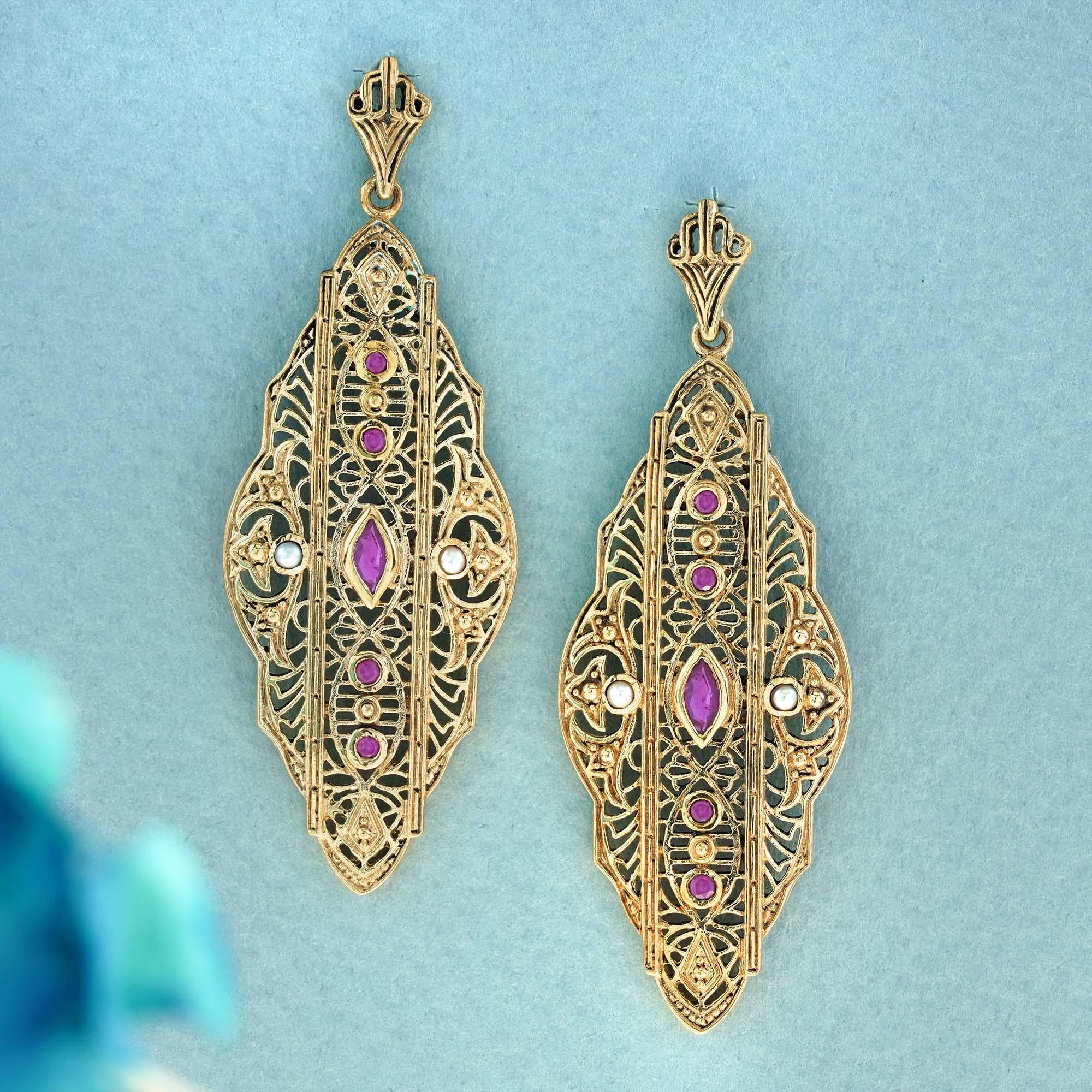 Delight in the captivating blend of red, white, and gold with these mesmerizing vintage-style filigree leaf-inspired earrings, featuring a cascade of five rubies. The enduring allure of the central marquise ruby, flanked by round white pearls on