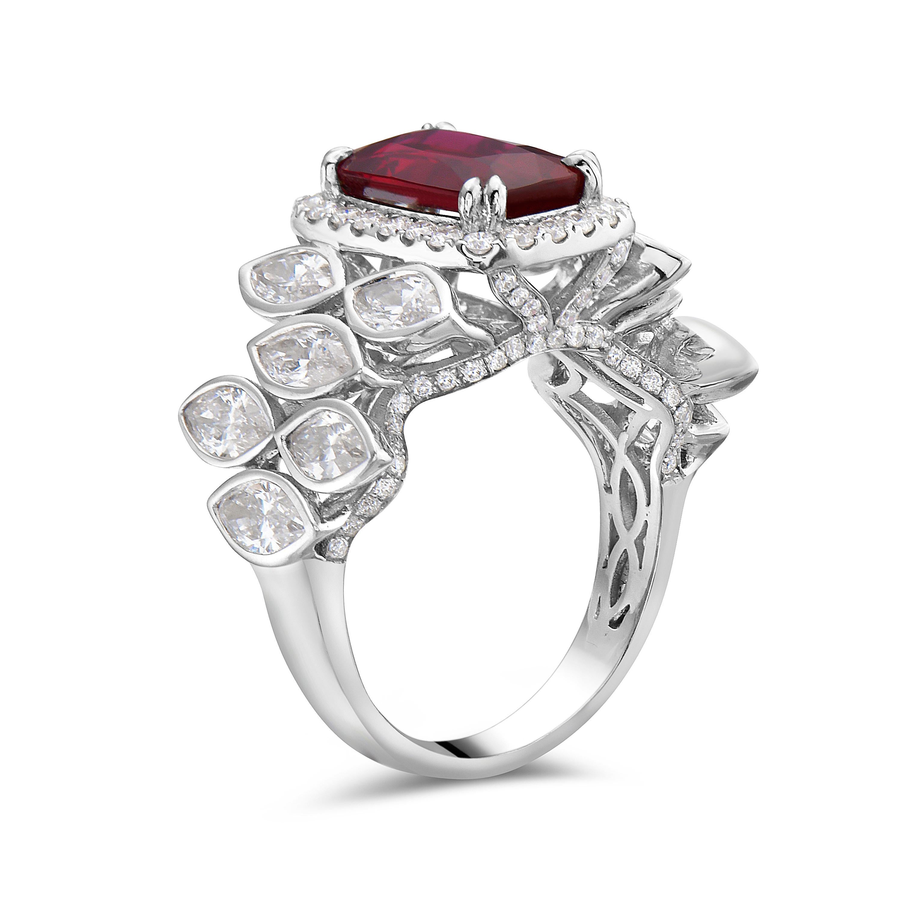 This mesmerising 3.04 ctw cushion cut ruby ring is accented with 2.86 ctw white diamonds set in 18K white gold
ID - RI613421
Metal: 18K White Gold
Stone: Ruby
Stone Cut: Cushion
Stone Carat Total Weight: 3.04 ctw
Diamond:  White Diamond
Diamond