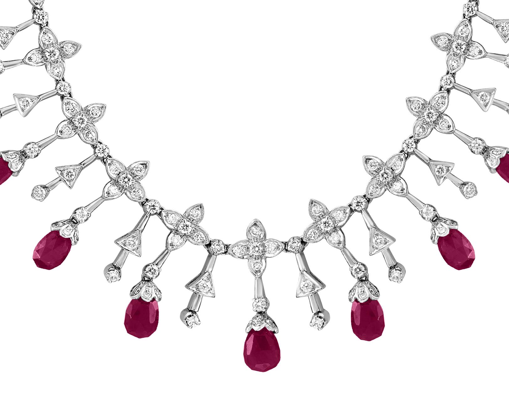    Ruby  Briolettes and Diamond Necklace in 18 Karat Gold 
This spectacular Necklace  consisting of 13 Briolettes  of  Ruby approximately  18 Carats.  The  Ruby  is surrounded by approximately 10 Carats of  brilliant cut diamonds . 
18 K gold 37