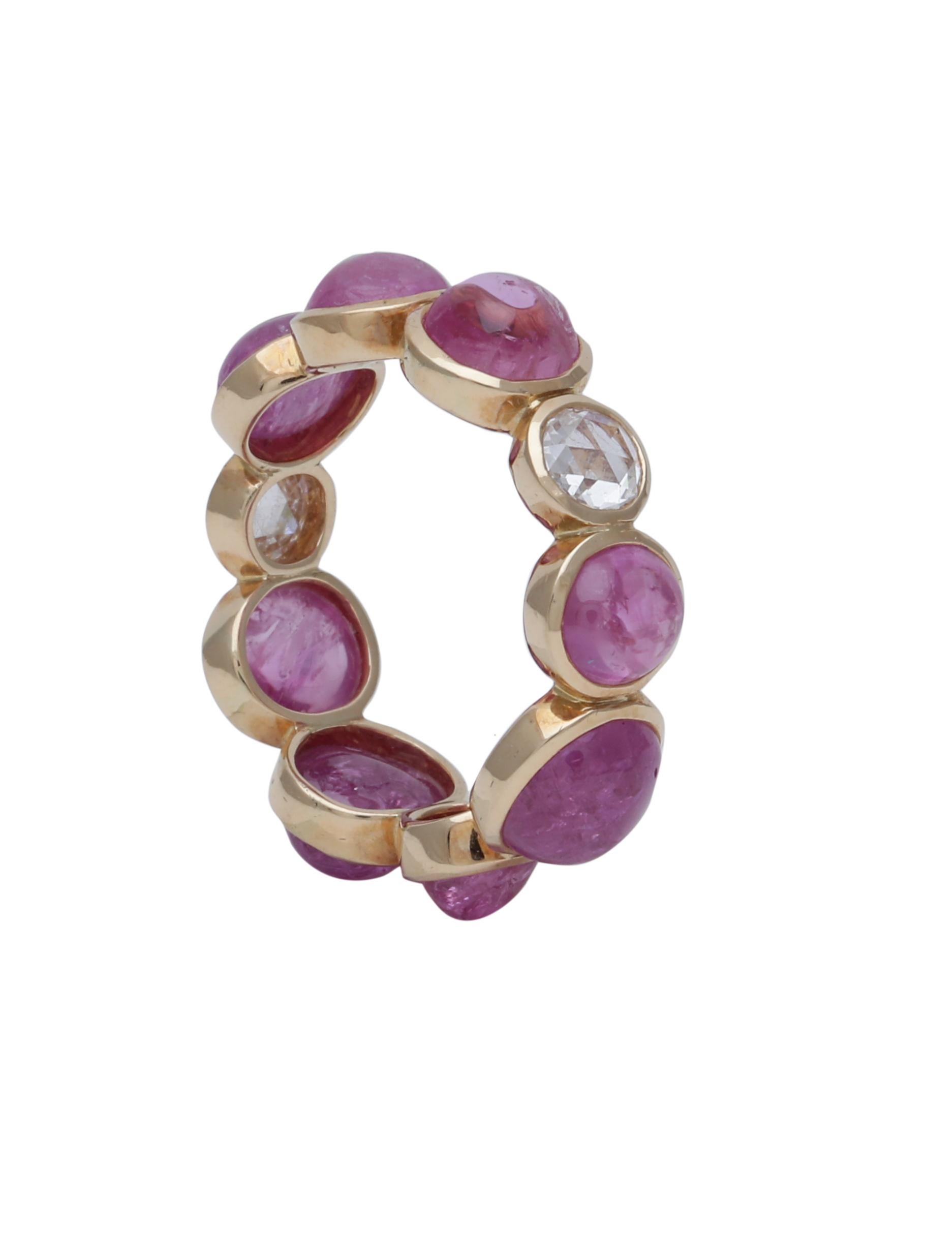 A natural Pink Ruby Cabochon Band with Round Rose cut diamonds carefully handcrafted in 18K Yellow Gold. The weight of the beautiful pink natural Rubies is 10.75cts and the Diamond Rosecuts are 0.50cts.

This could be worn as a stackable ring with