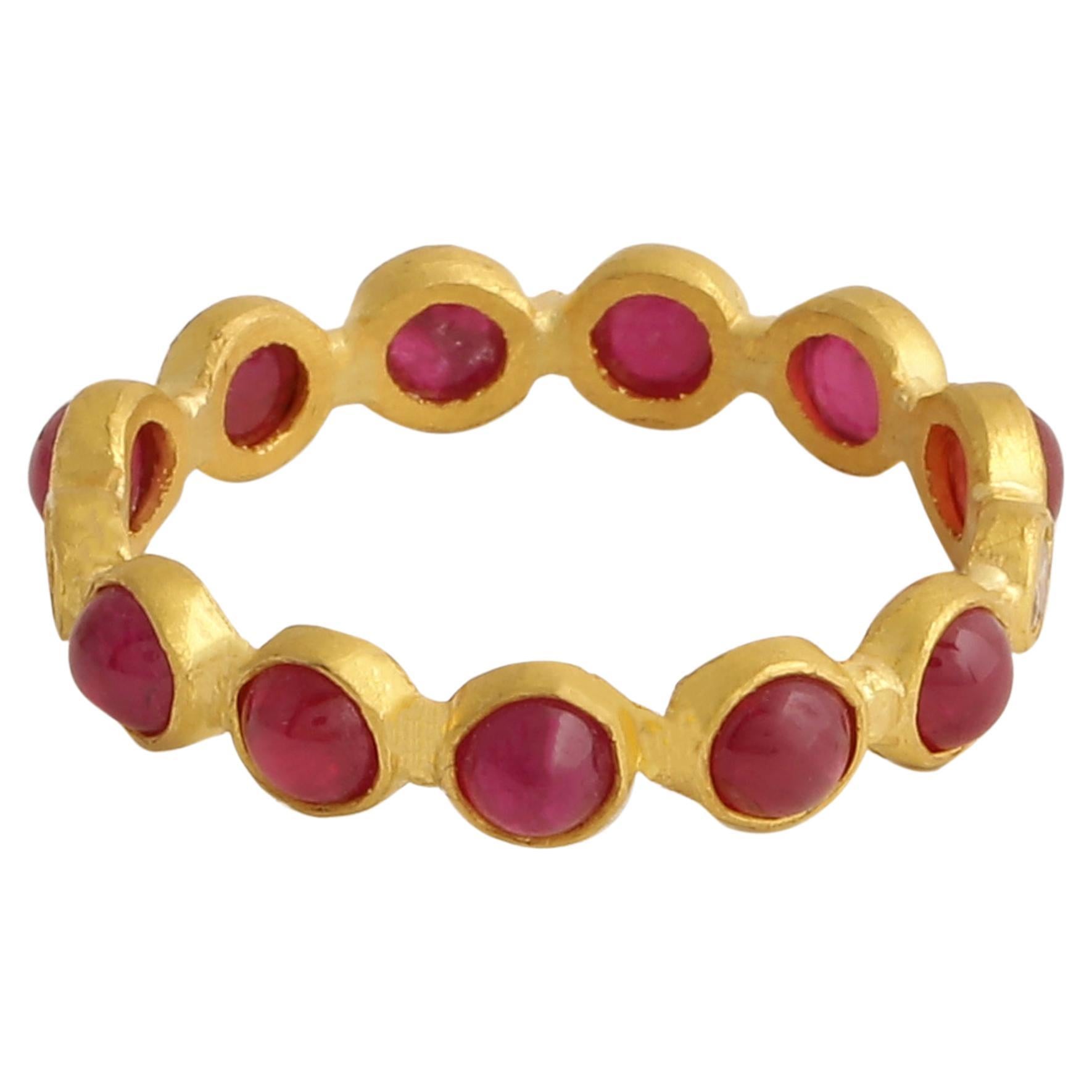 A beautiful Natural Ruby Cabochon band ring handcrafted in 22k Matte Gold with brown diamonds. Stackable jewelry is the hottest trend of the season and this ring is one of the most versatile pieces for it. It can be worn independently as an