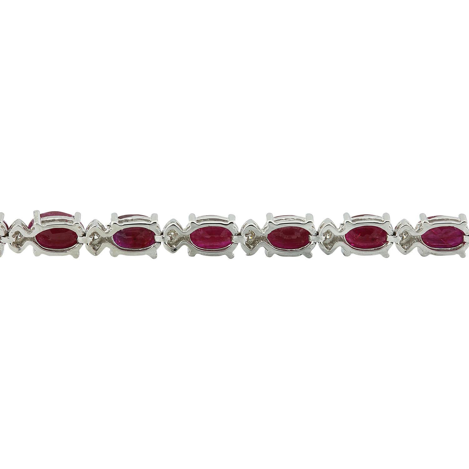 11.95 Carat Natural Ruby 14 Karat Solid White Gold Diamond Bracelet
Stamped: 14K
Total Bracelet Weight: 11.1 Grams
Bracelet Length: 7.0 Inches 
Ruby  Weight: 11.45 Carat (6.00x4.00 Millimeters) 
Diamond Weight: 0.50 Carat (F-G Color, VS2-SI1 Clarity