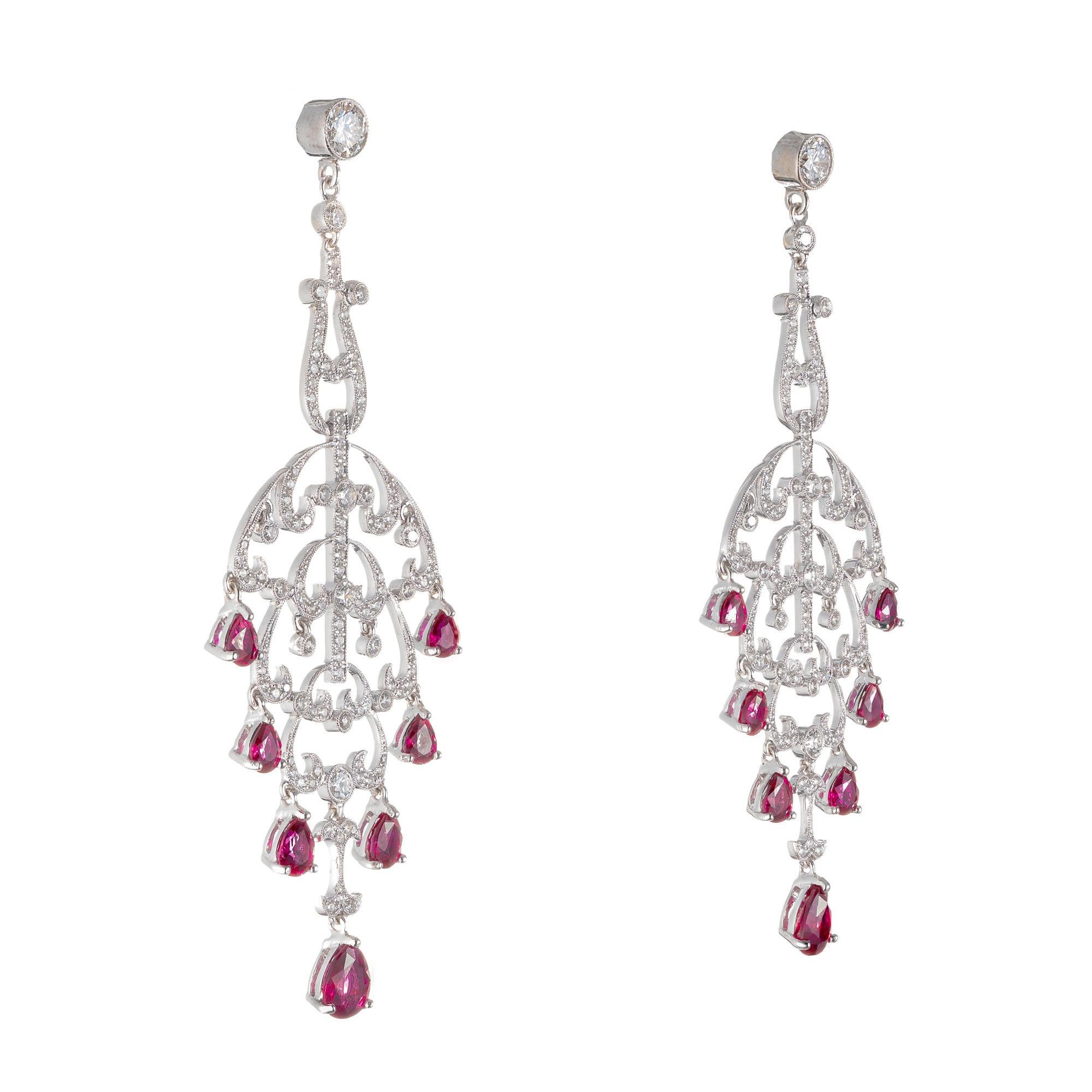 circa 1940-1950. Hand bead set and top gem red natural  no heat certified Rubies. One Ruby on each earring was GIA random tested. Both tested natural .14  matched custom cut bright pear shaped Rubies. 220 full cut diamonds. The earrings themselves,