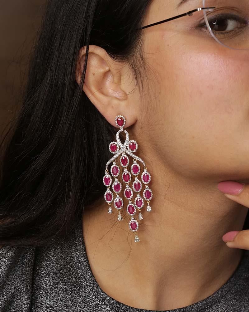 Introducing our exquisite 18K Yellow Gold Ruby Gemstone Earrings, a stunning blend of luxury and elegance, designed to captivate and impress.
Specifications:

    Dimensions: 70 x 30 mm
    Gross Weight: 34.100 gms
    Gold Weight: 28.322 gms
   