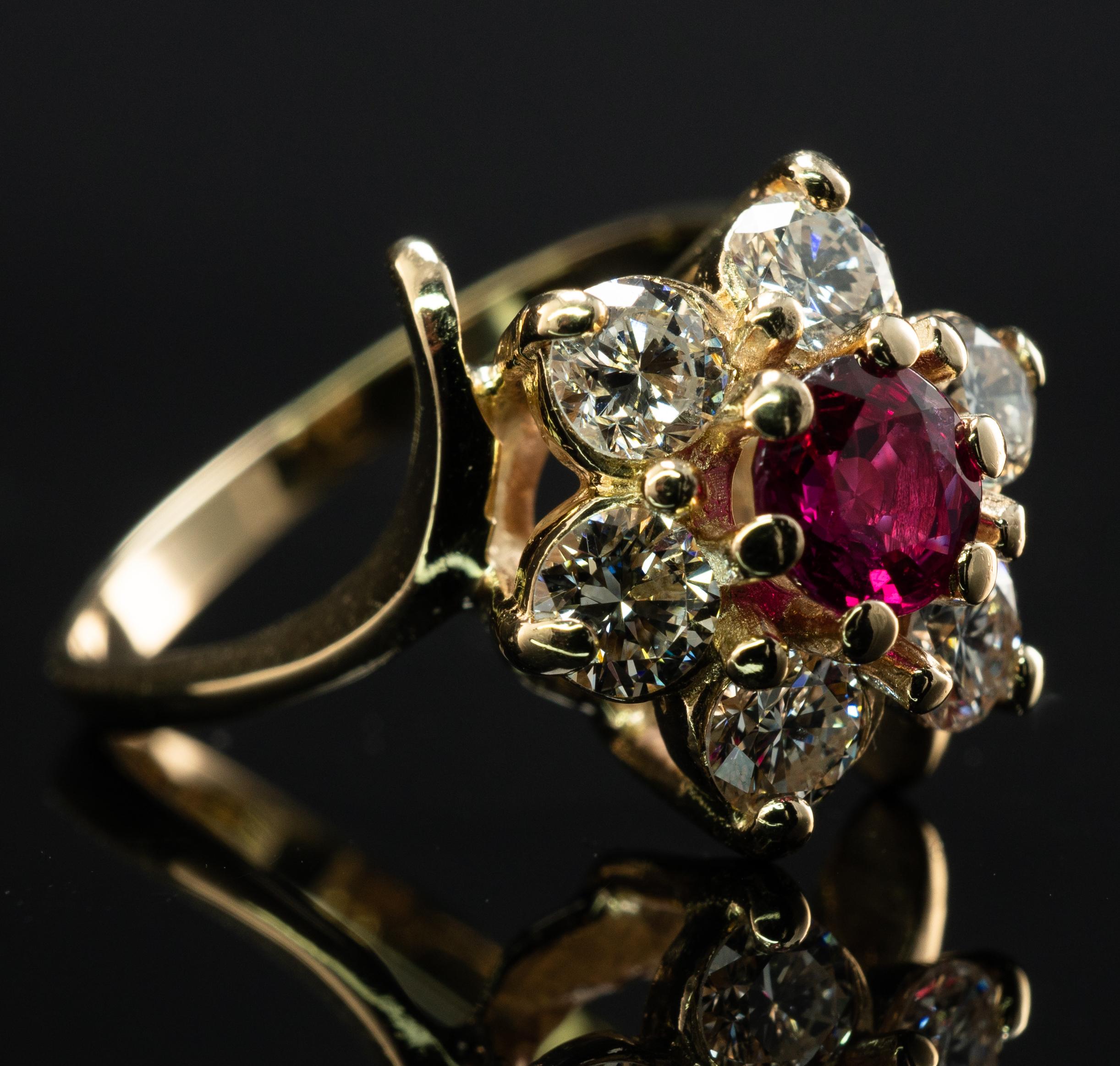 Natural Ruby Diamond Ring 18K Gold Vintage Flower

This lovely estate ring is finely crafted in solid 18K Yellow Gold (carefully tested and guaranteed) and set with natural Earth mined Ruby and diamonds.
The center round cut stone measures 5mm (.65