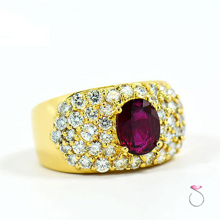 This Magnificent natural Ruby & Diamond ring in 18K yellow gold is a real beauty. Featuring an approximately 1.30 carat rich red oval Ruby that scream with passion. The center ruby is set in four prongs surrounded by a diamond 44 Pave' set round