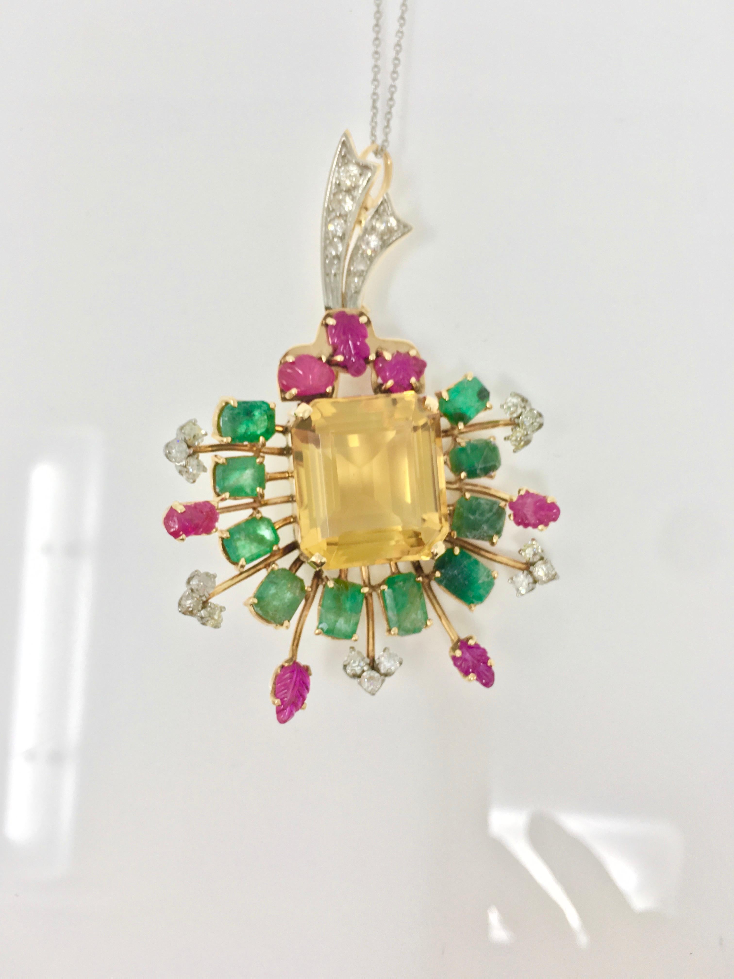 An attractive Ruby, Emerald , Citrine and White diamond broach/ pendant features a beautiful citrine weighing 25 carat approximately ,7 carved rubies weighing 3 carat approximately , 10 emeralds weighing 10 carat approximately and 25 small white