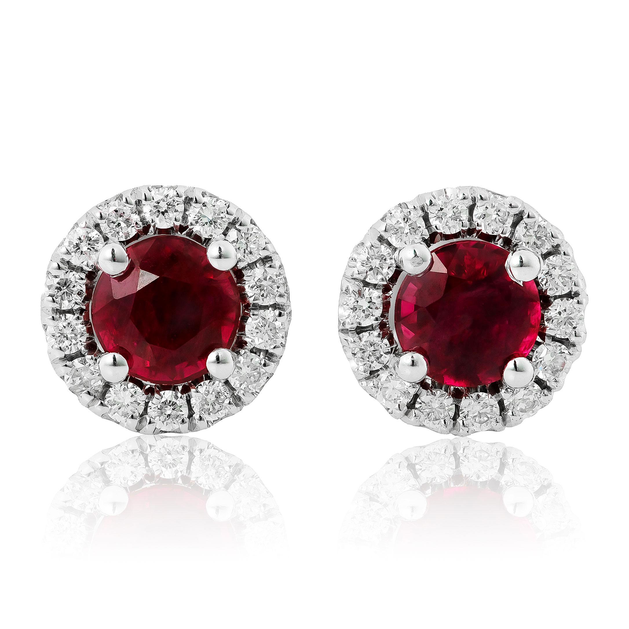 Discover the timeless allure of these natural ruby earrings, featuring a total weight of 0.74 carats, set in elegant 14K white gold. Accented by 0.19 carats of sparkling diamonds, these earrings exude classic beauty and sophistication, perfect for