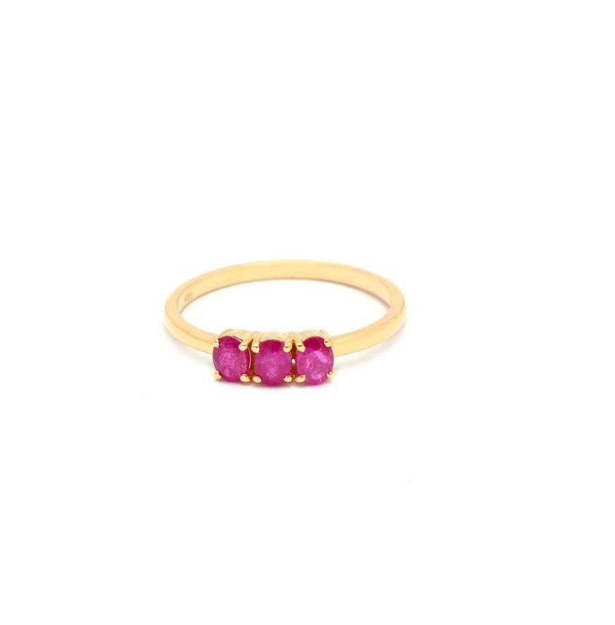 This elegant 14K Solid Yellow Gold ring features two 3 ruby stone placed in a gracefully looped gold band! The 0.65 Carat Ruby Natural Gemstone adds that splash of pink, that can brighten up any dull look. 

Specification: 

Dimensions: RING