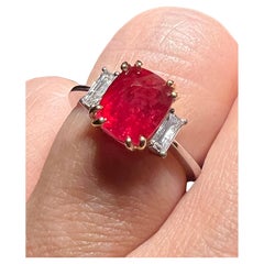 Natural Ruby Ring Surrounded By Diamonds In 18 Carat White Gold