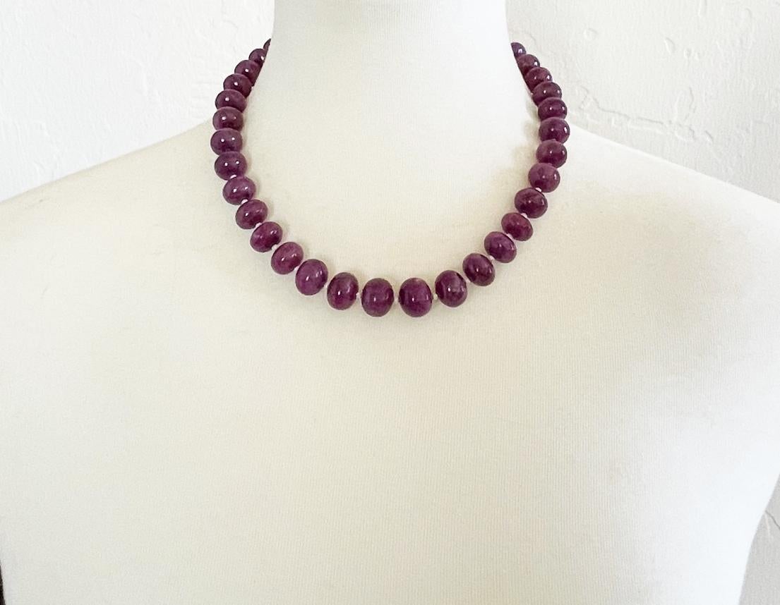 Gorgeous necklace made with natural superb quality ruby rondelle beads (12-14mm), tiny sterling silver accent beads, and finished with a sterling silver toggle clasp with chevron inlaid mother of pearl. This necklace measures approximately 18.5