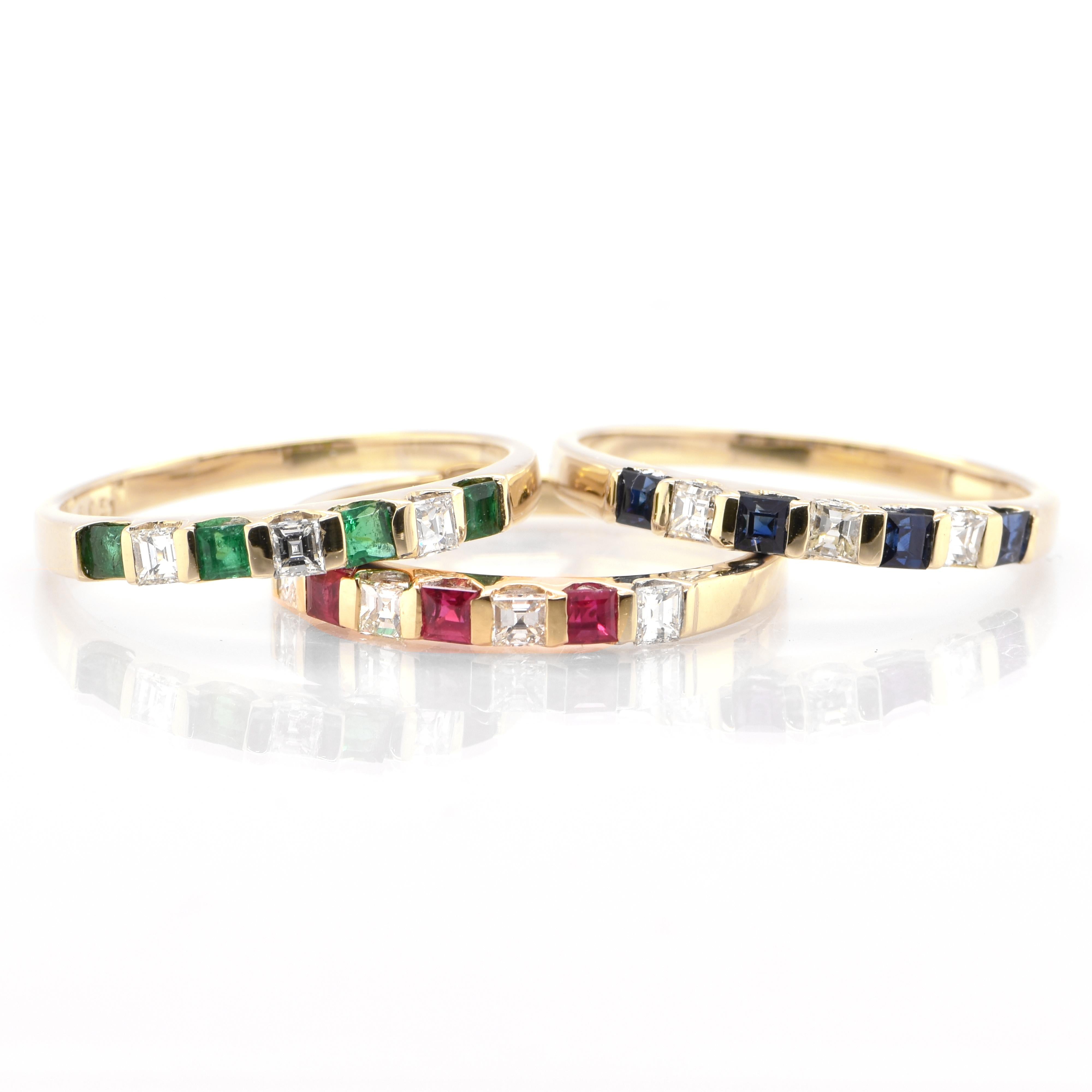 A stunning set of Natural Ruby, Sapphire and Emerald stackable rings set in 18 Karat Yellow Gold. The Ruby ring features 0.26 carats of Natural Rubies and 0.57 carats of Natural Diamonds. The Emerald ring features 0.26 carats of Natural Emeralds and