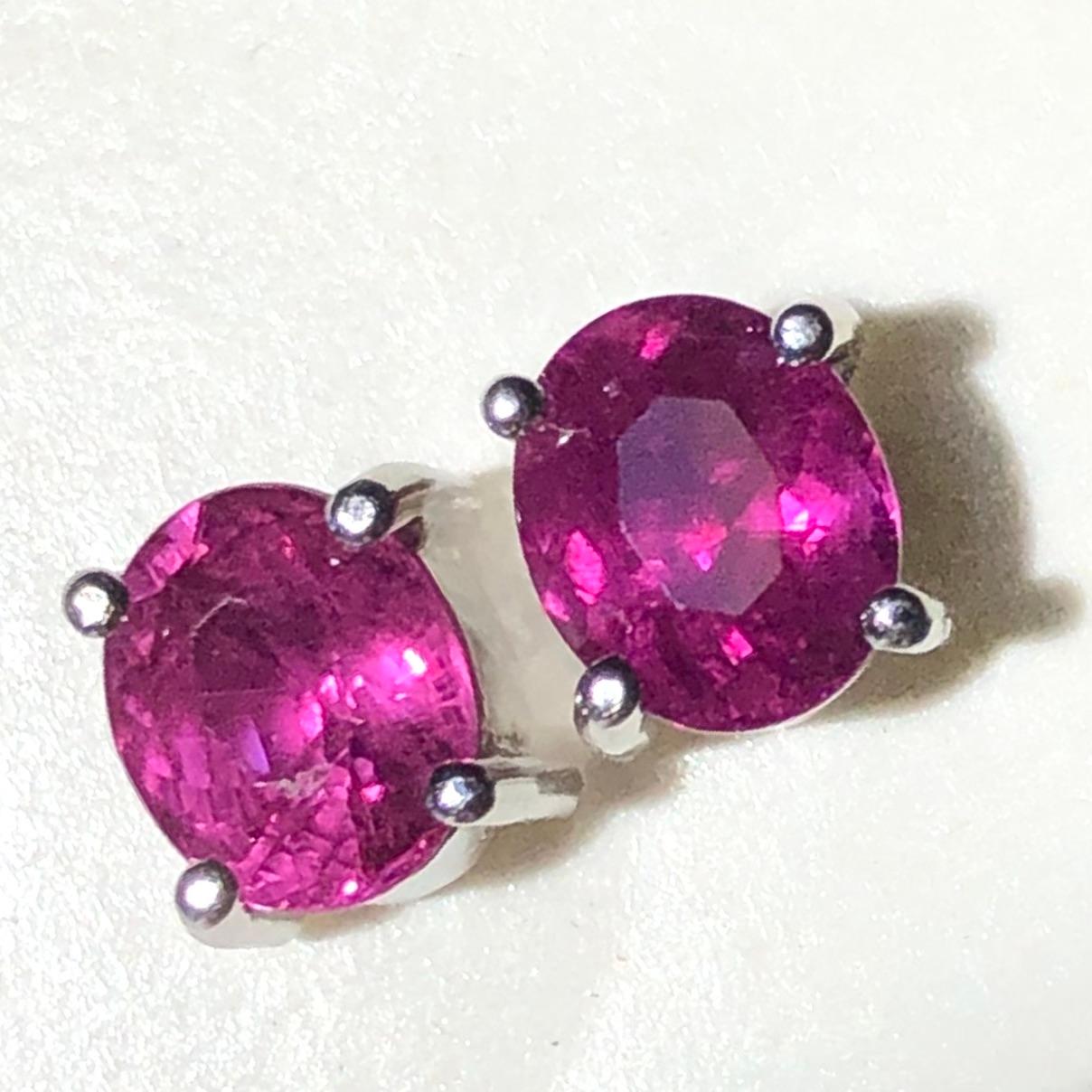 ESTATE 18K WHITE GOLD EARRINGS. OVAL AAA RUBIES ARE 2.00 CARATS.

A classic pair of stud earrings showcasing pinkish red rubies oval cut untreated weigh 2.00 carats total. Made in 18 karats white gold.
Condition: Estate/ Excellent condition