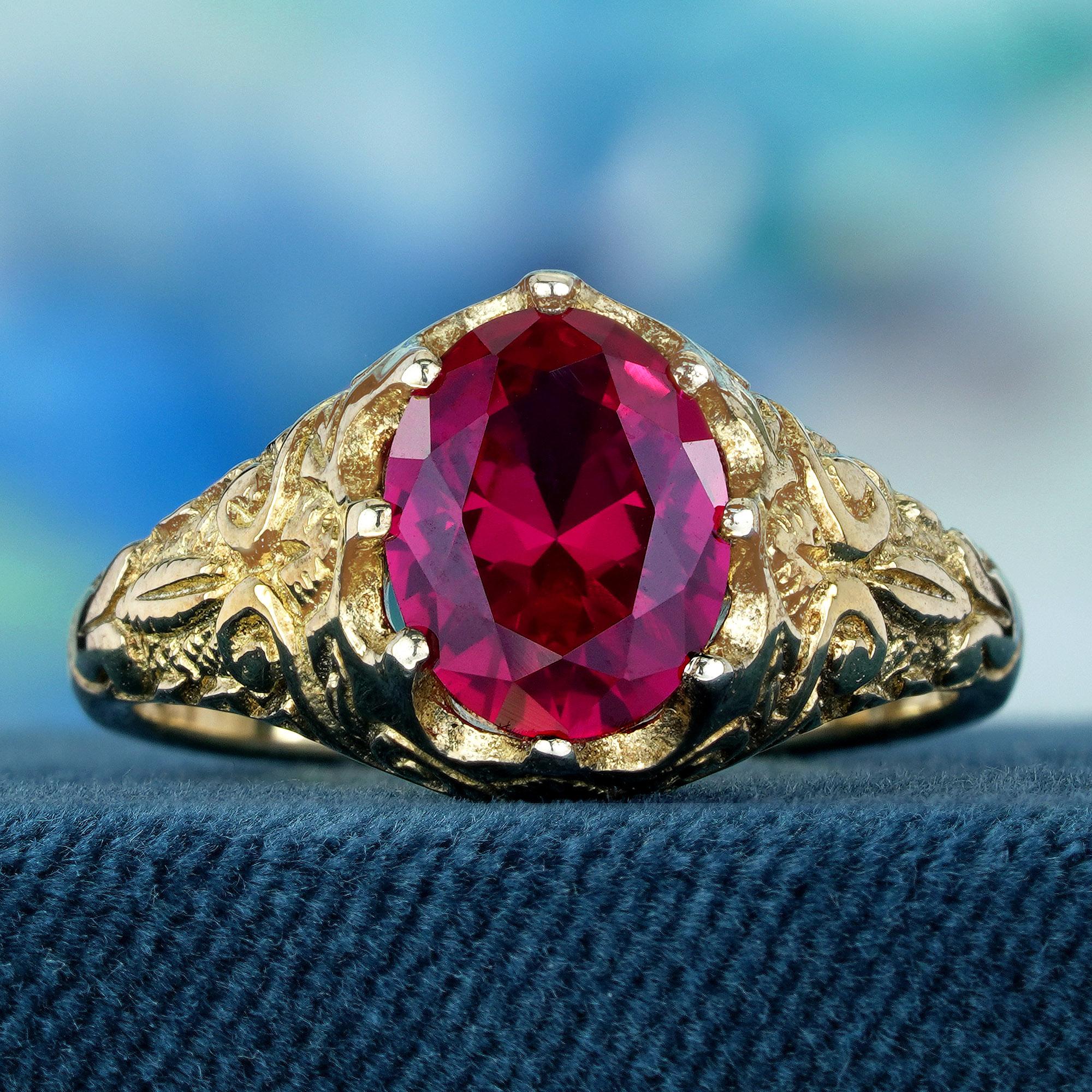 Dazzled by a faceted fiery oval red ruby gemstone, this ring is a testament to intricate craftsmanship set in delicate yellow gold. The swirling carved band showcases exceptional artistry and meticulous attention to detail. Treat yourself to a touch
