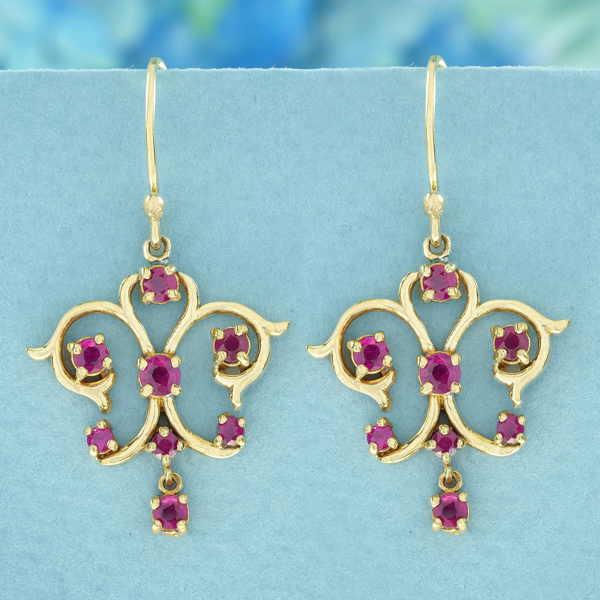 Embrace timeless elegance with these captivating dangle earrings. Each earring features a stunning round ruby nestled in delicate golden scrollwork, evoking a sense of vintage glamour and lasting sophistication.
Whether you're wearing them for a