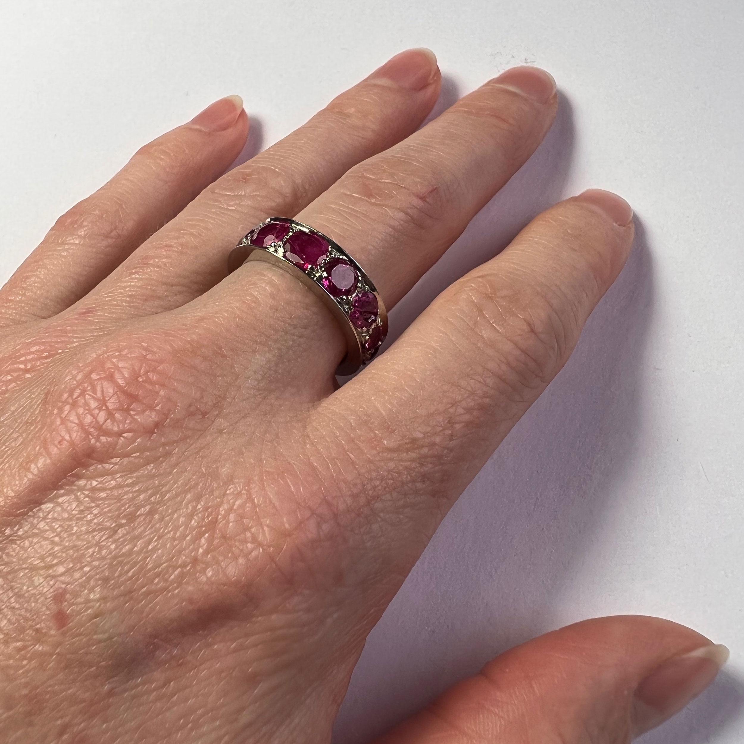 An 18 karat white gold ring set with ten cushion cut natural untreated rubies weighing an approximate total of 4.10 carats.

Ring size 6.75 (US), N (UK).

